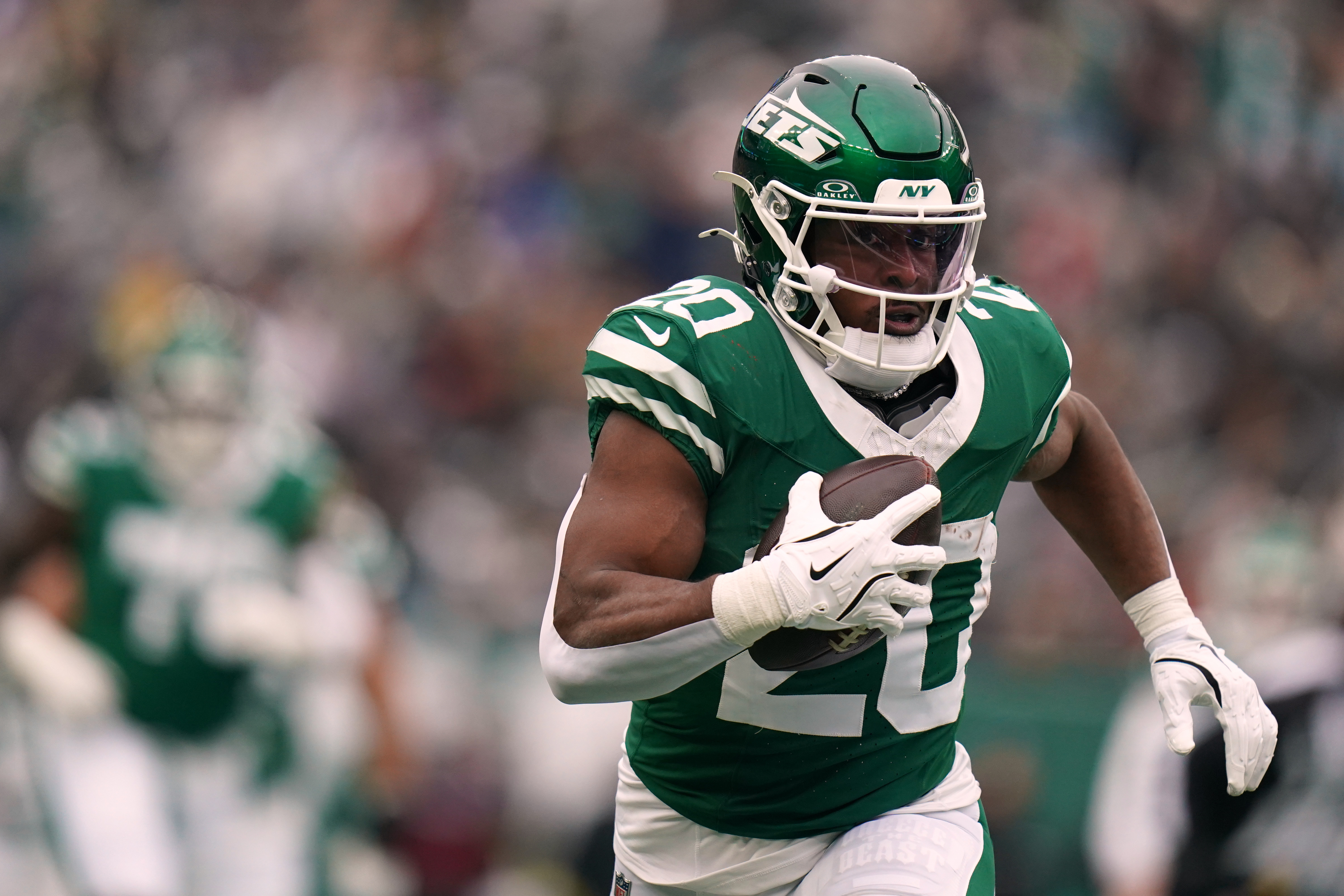 FILE - New York Jets running back Breece Hall (20) carries the ball during an NFL football game against the New England Patriots, Dec. 28, 2025, in New York. 