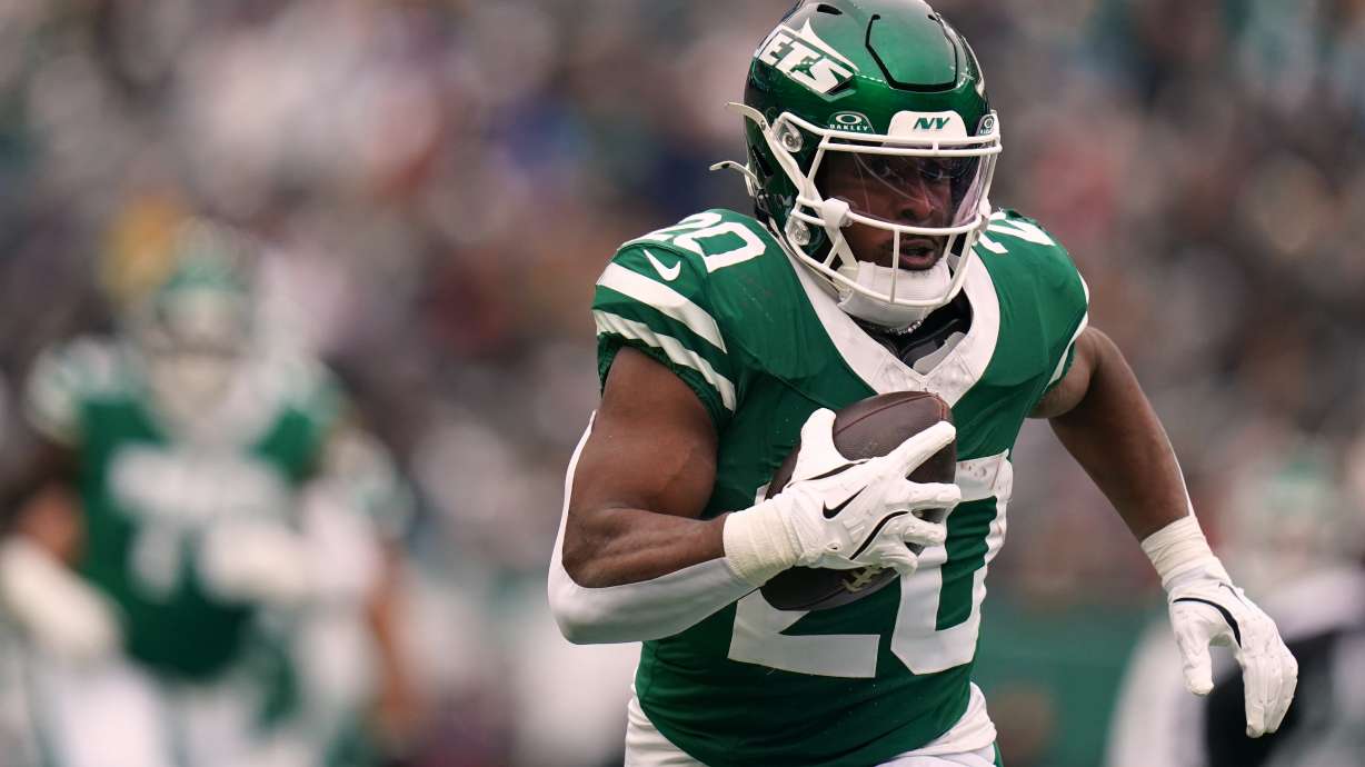 FILE - New York Jets running back Breece Hall (20) carries the ball during an NFL football game against the New England Patriots, Dec. 28, 2025, in New York.