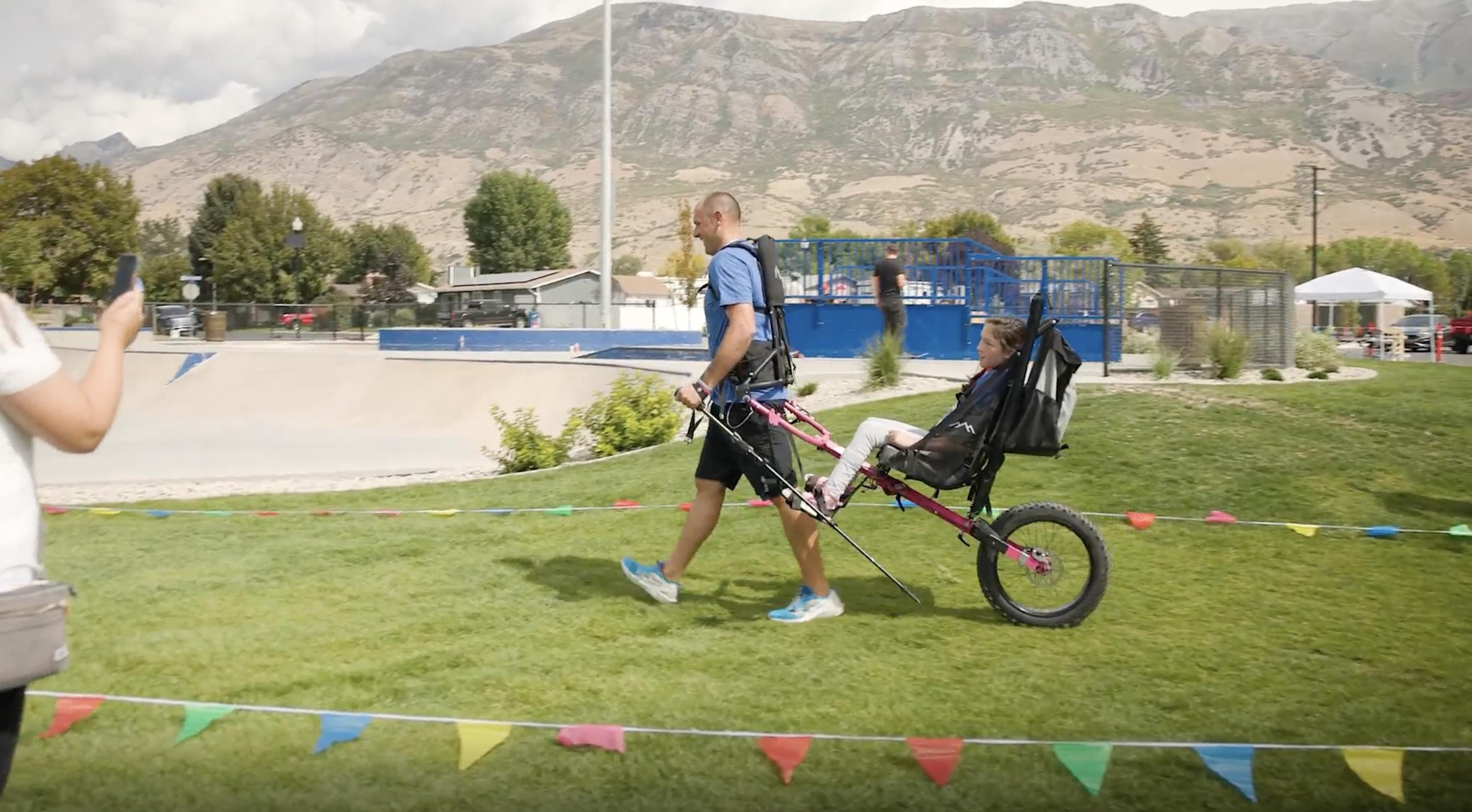 People participate in Pleasant Grove's Berserker Blitz, an adaptive obstacle course that uses all-terrain wheelchairs for people with disabilities, at Cook Family Park in September 2025.