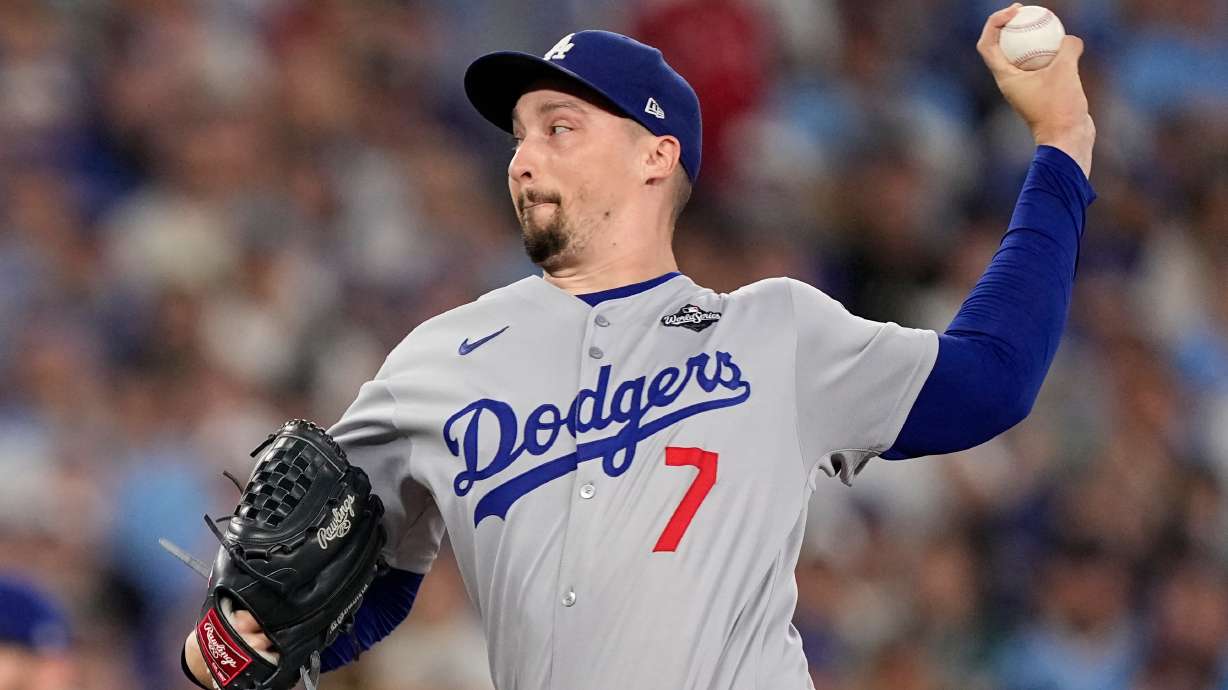 FILE - Los Angeles Dodgers pitcher Blake Snell throws against the Toronto Blue Jays during the eighth inning in Game 7 of baseball's World Series, on Nov. 1, 2025, in Toronto.