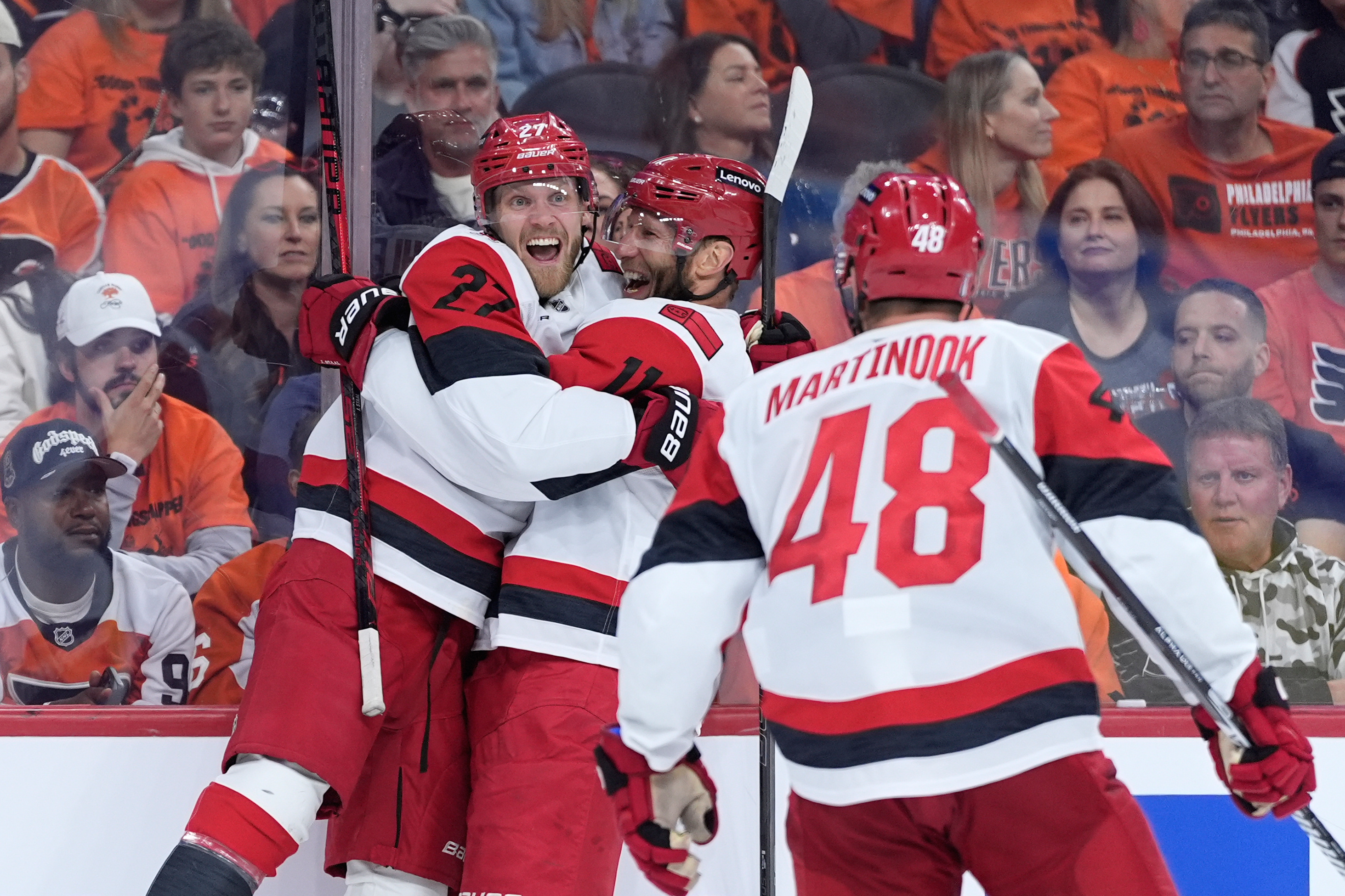 Carolina Hurricanes' Nikolaj Ehlers, from left, Jordan Staal and Jordan Martinook celebrate after a goal by Ehlers during the third period of Game 3 in the second round of the NHL hockey Stanley Cup playoffs against the Philadelphia Flyers Thursday, May 7, 2026, in Philadelphia. 