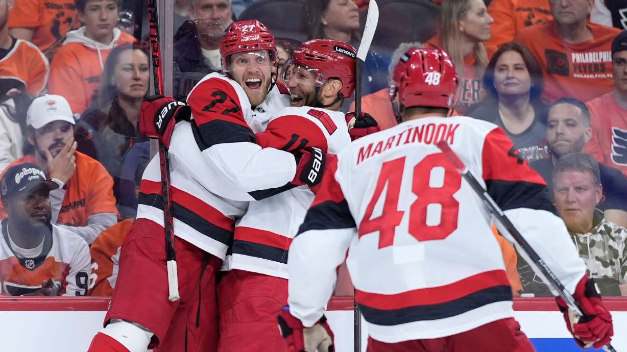 Carolina Hurricanes' Nikolaj Ehlers, from left, Jordan Staal and Jordan Martinook celebrate after a goal by Ehlers during the third period of Game 3 in the second round of the NHL hockey Stanley Cup playoffs against the Philadelphia Flyers Thursday, May 7, 2026, in Philadelphia.