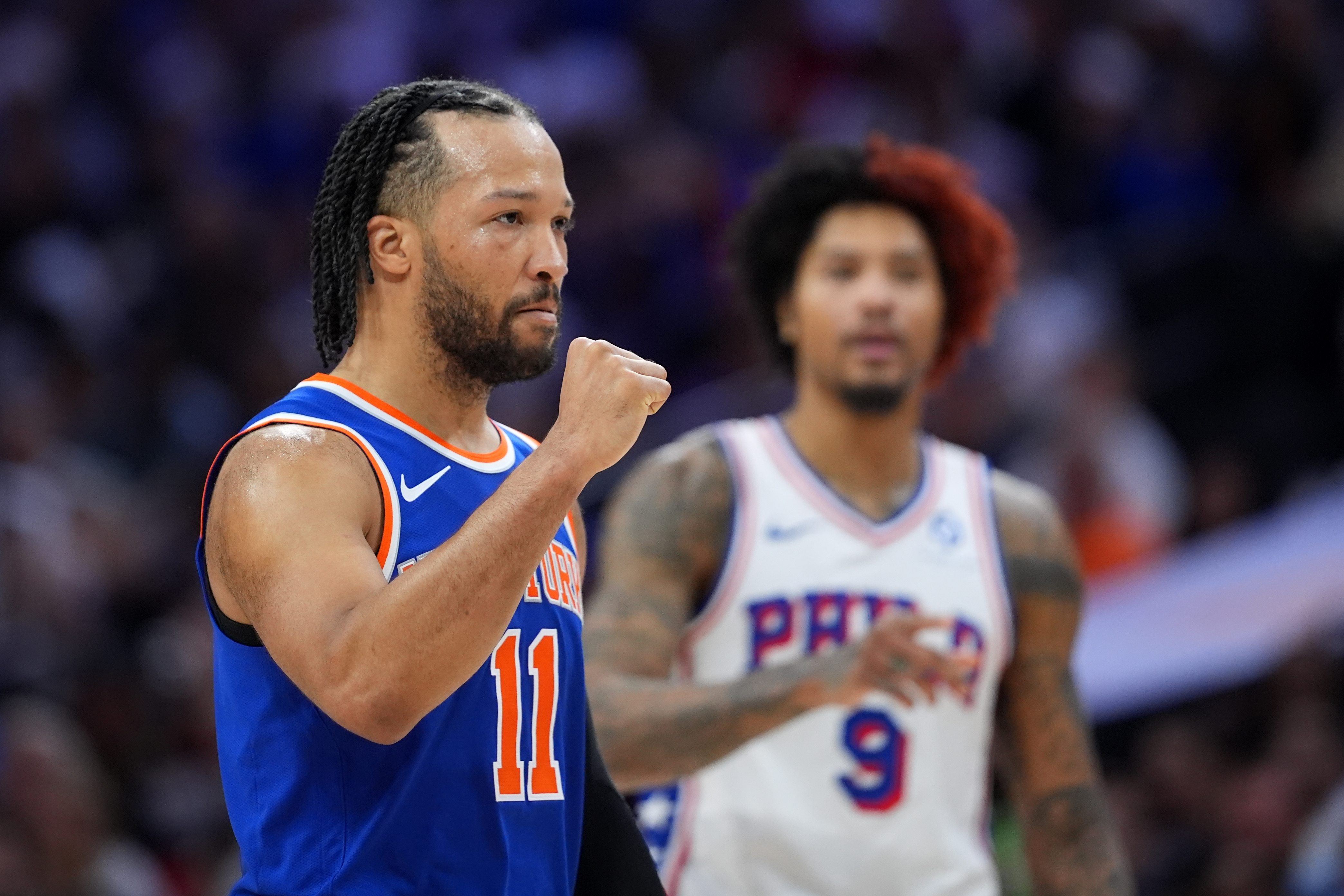 New York Knicks' Jalen Brunson, left, reacts past Philadelphia 76ers' Kelly Oubre Jr. during the first half of Game 3 in a second-round NBA basketball playoff series Friday, May 8, 2026, in Philadelphia.