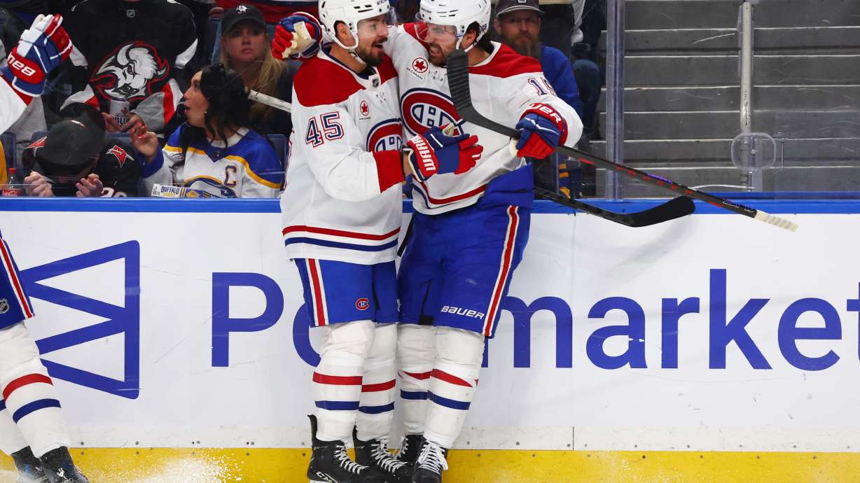 Montreal Canadiens center Alex Newhook (15) celebrates his goal with defenseman Alexandre Carrier (45) during the second period in Game 2 of a second-round NHL hockey Stanley Cup playoff series against the Buffalo Sabres Friday, May 8, 2026, in Buffalo, N.Y.