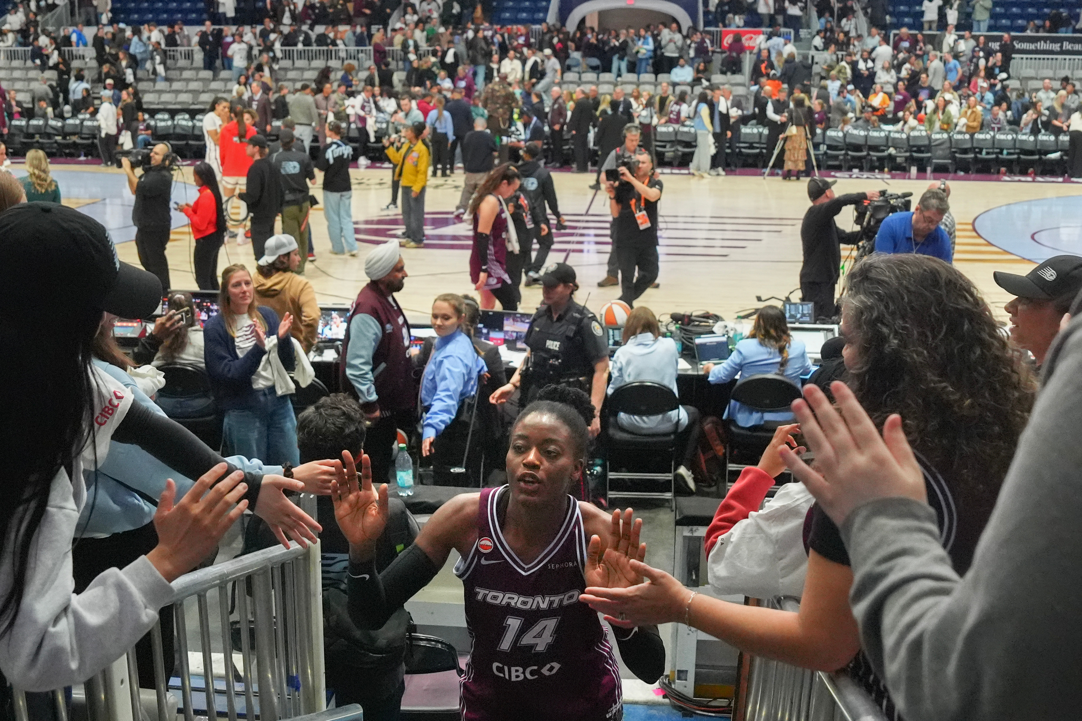 Toronto's first WNBA game is no thing of beauty, but sellout crowd finds plenty to cheer
