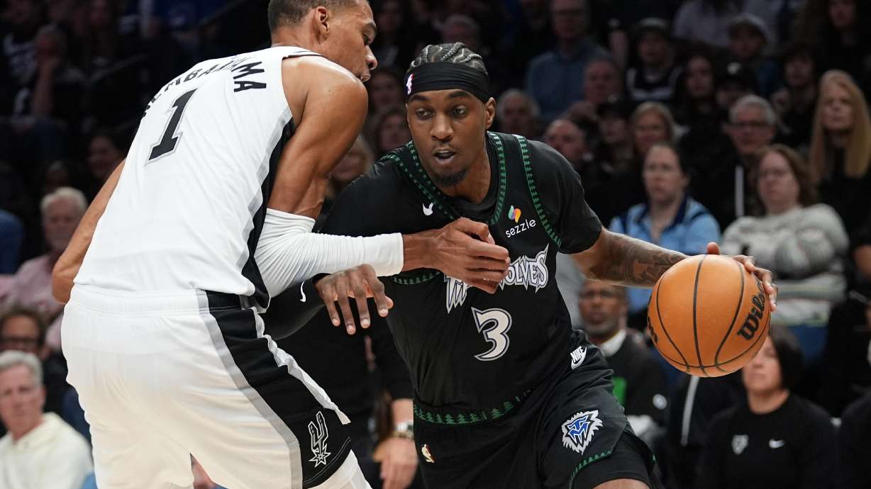 Minnesota Timberwolves forward Jaden McDaniels (3) drives against San Antonio Spurs forward Victor Wembanyama (1) during the first half of Game 3 of a NBA basketball second-round playoff series in Minneapolis, Friday, May 8, 2026.