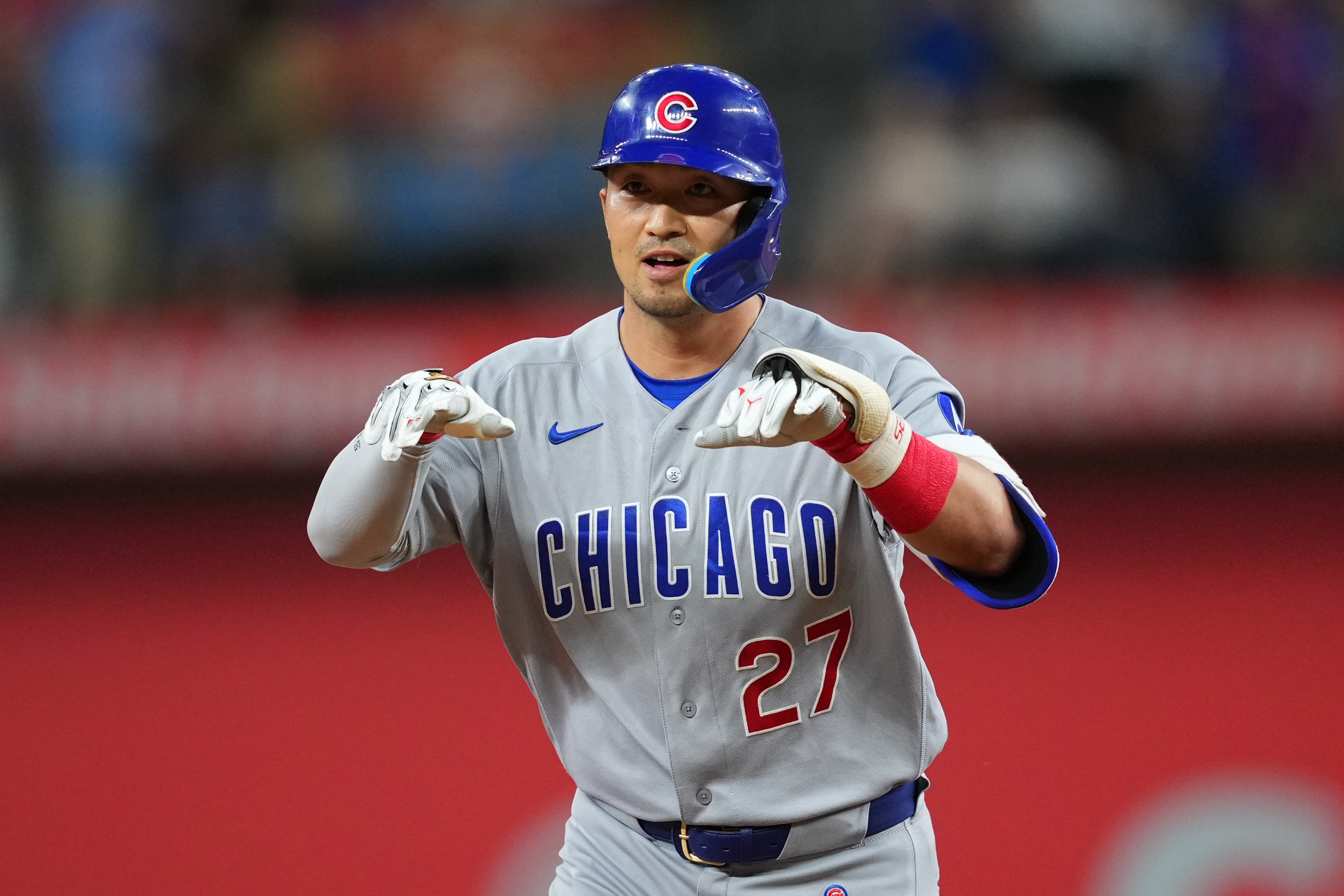 Chicago Cubs' Seiya Suzuki gestures while running the bases after hitting a two-run home run off Texas Rangers starting pitcher Kumar Rocker during the fourth inning of a baseball game Friday, May 8, 2026, in Arlington, Texas. 