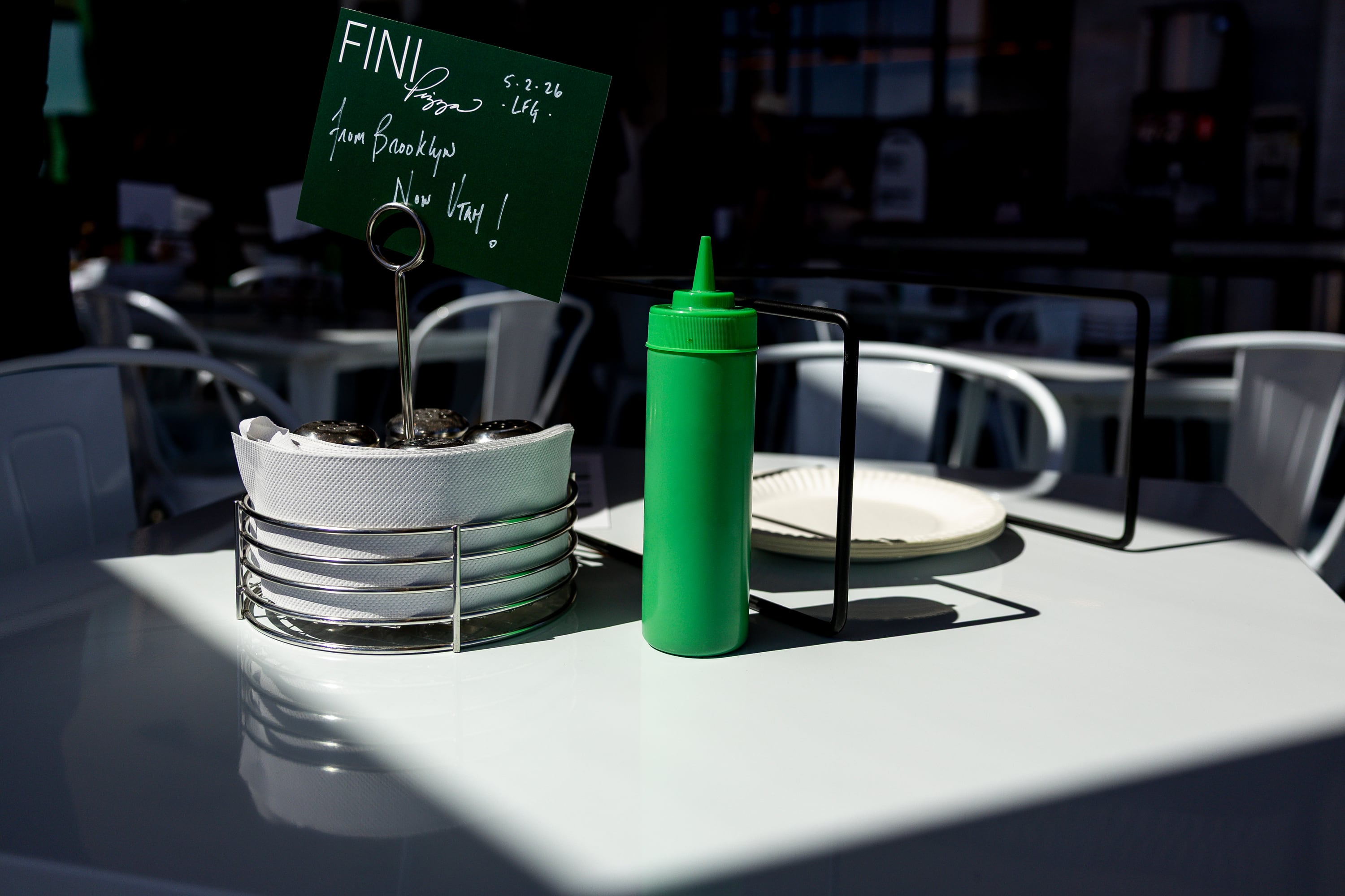 Sunlight shines on a table at Fini Pizza during the grand opening of its first location outside of New York in Vineyard on May 2. Owner Sean Feeney said he brought the pizzeria to Utah because of his love for the state's values.