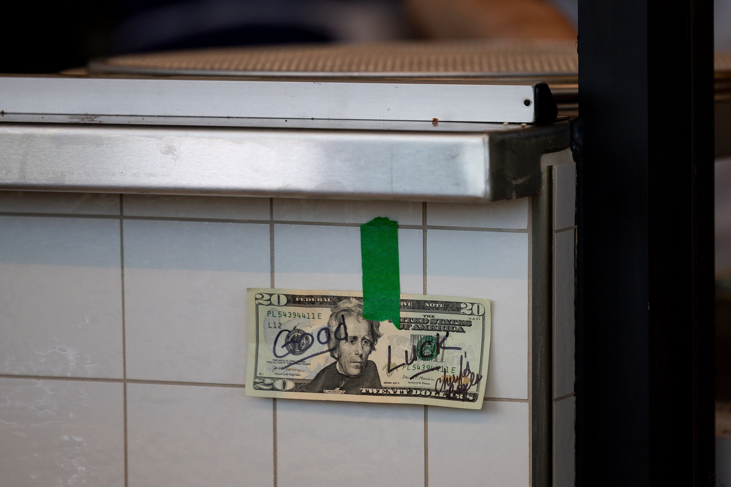 The bill from the first purchase during the grand opening of Fini Pizza in Vineyard is taped to the wall behind the service counter on May 2. Reminders of the original locations in New York also hang throughout the restaurant.