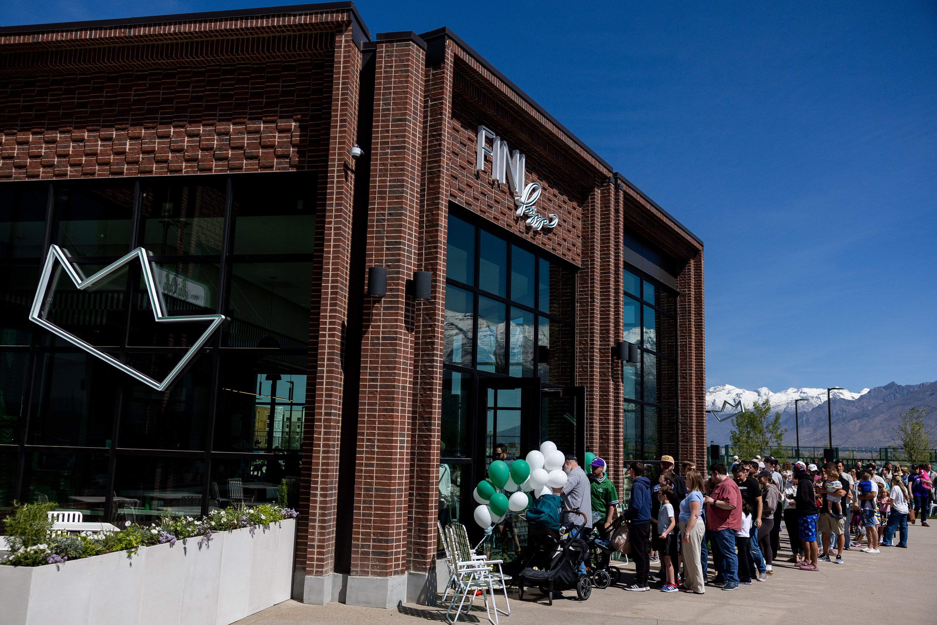 The first customers of the first Fini Pizza location outside of New York make their way into the pizzeria during the grand opening in Vineyard on May 2. The pizzeria had quite a debut in its first week.