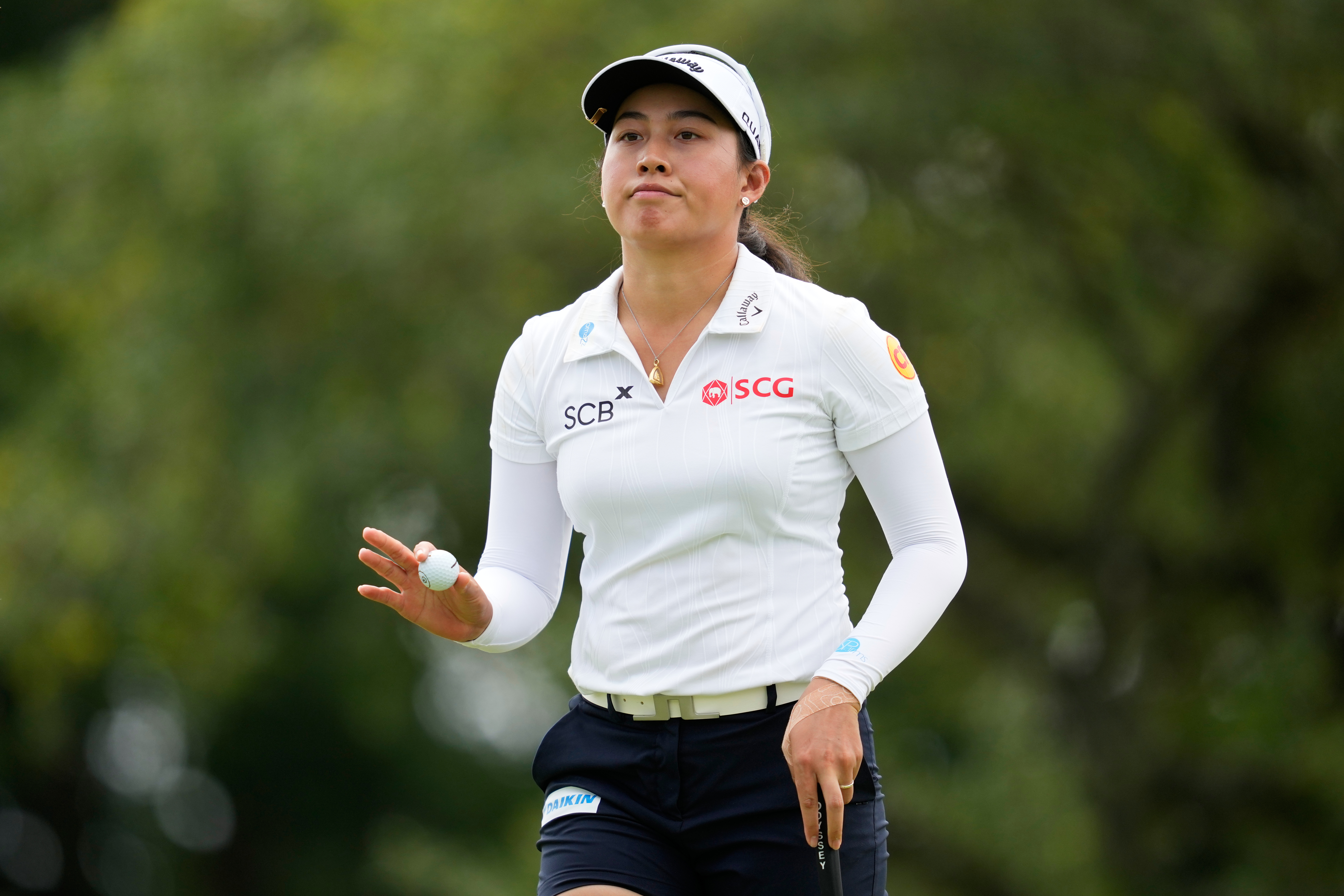 Jeeno Thitikul, of Thailand, waves after making a putt on the 13th hole during the second round of the Chevron Championship LPGA golf tournament Friday, April 24, 2026, in Houston. 
