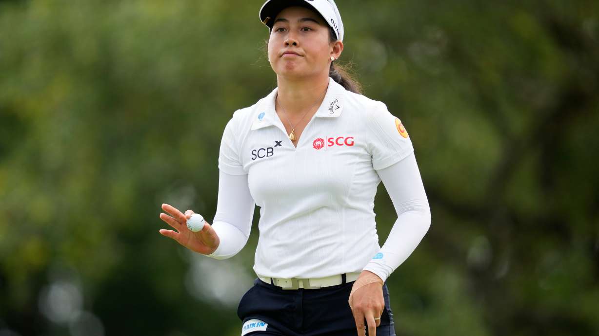 Jeeno Thitikul, of Thailand, waves after making a putt on the 13th hole during the second round of the Chevron Championship LPGA golf tournament Friday, April 24, 2026, in Houston.