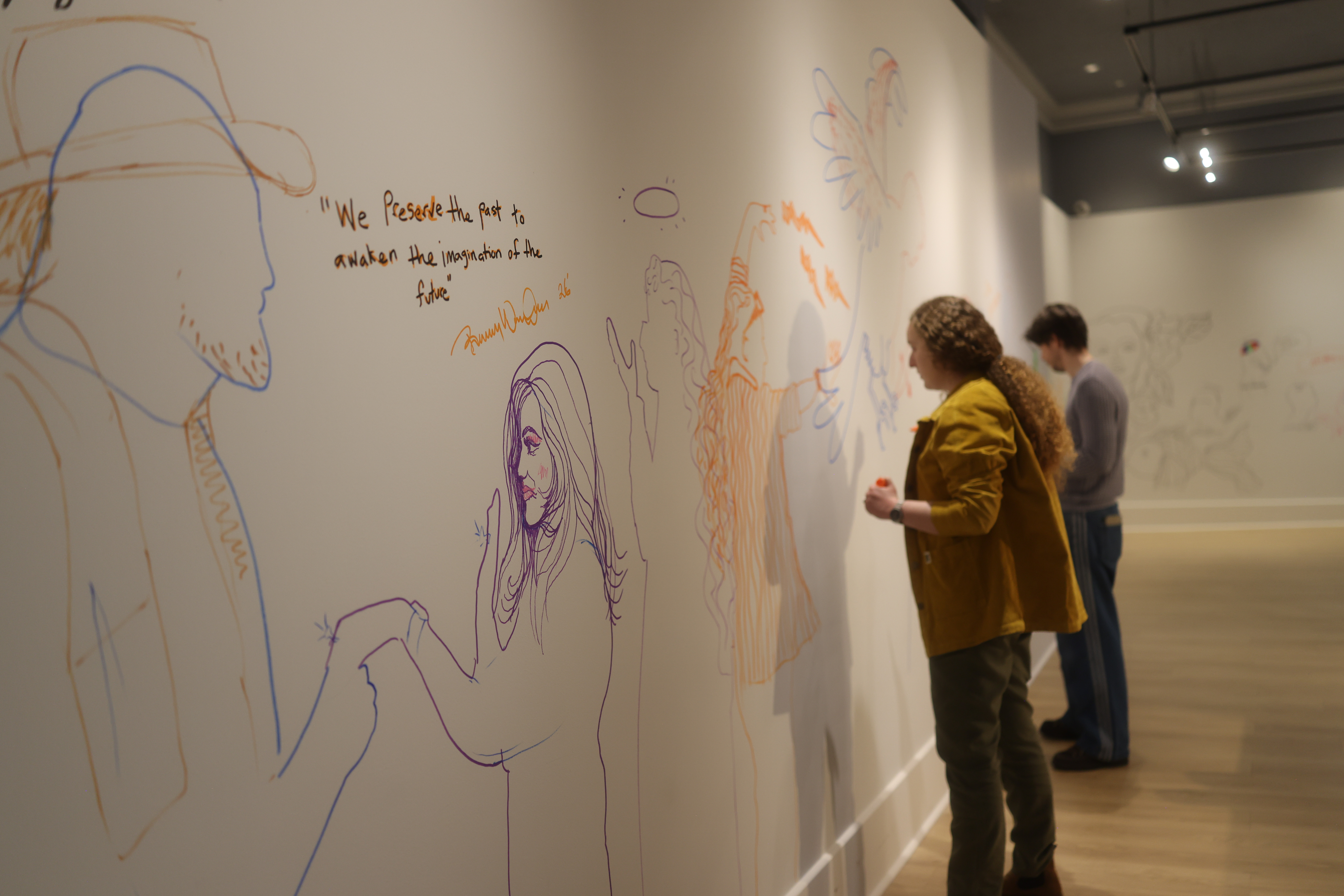 People participate in the "Make Your Mark" installation at the new Salt Lake Art Museum in Salt Lake City.