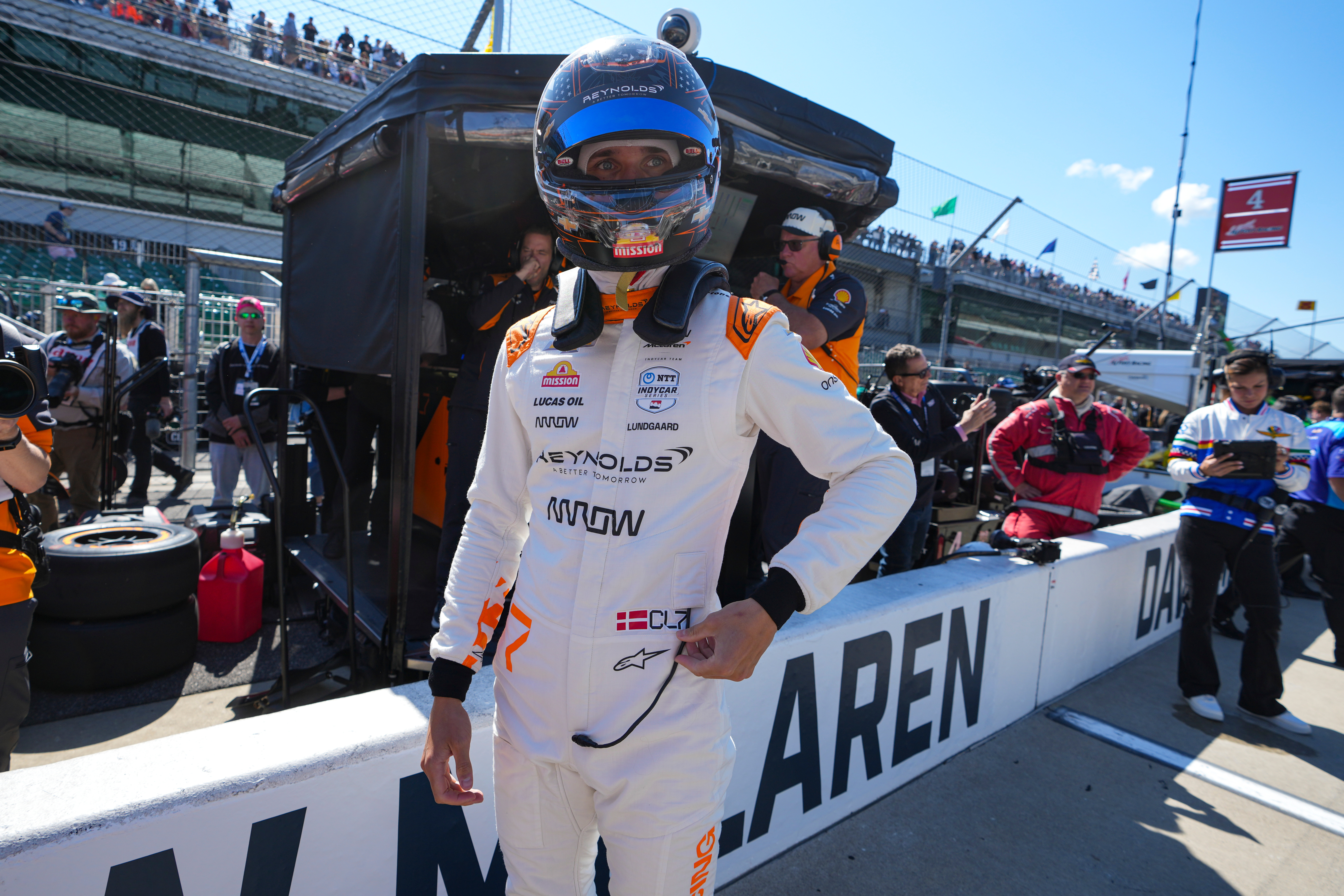 FILE - Christian Lundgaard, of Denmark, waits to climb into his car before the start practice for the Indianapolis 500 auto race at Indianapolis Motor Speedway in Indianapolis, May 23, 2025. 