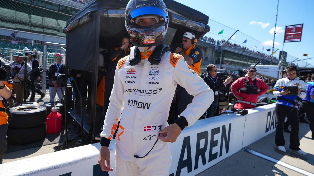 FILE - Christian Lundgaard, of Denmark, waits to climb into his car before the start practice for the Indianapolis 500 auto race at Indianapolis Motor Speedway in Indianapolis, May 23, 2025.