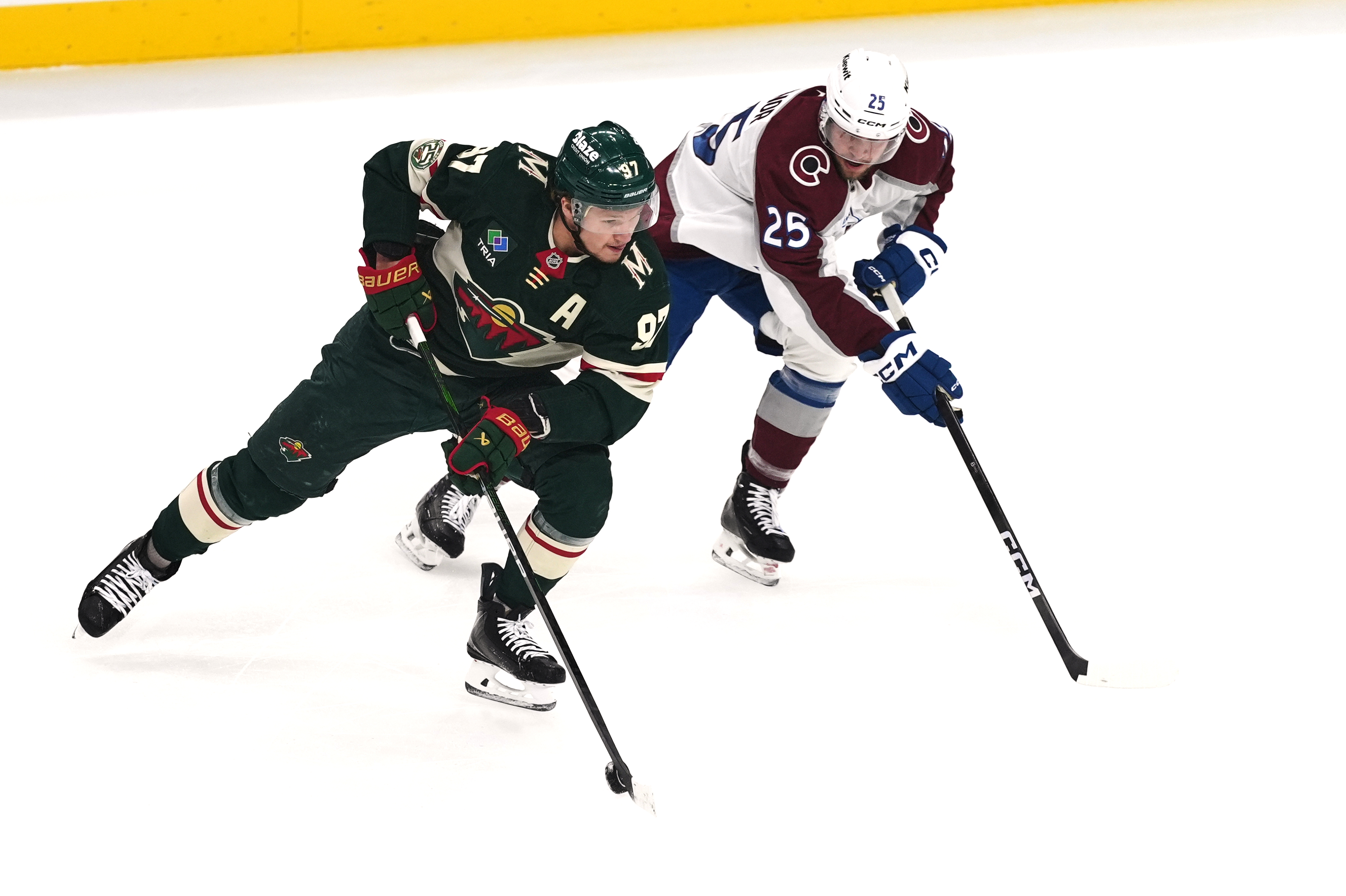 Minnesota Wild left wing Kirill Kaprizov (97) skates with the puck as Colorado Avalanche right wing Logan O'Connor (25) defends during the first period of Game 3 of an NHL Stanley Cup hockey second-round playoff series Saturday, May 9, 2026, in St. Paul, Minn. 