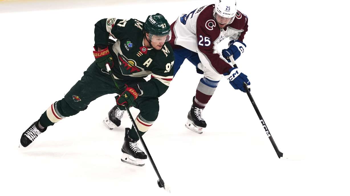 Minnesota Wild left wing Kirill Kaprizov (97) skates with the puck as Colorado Avalanche right wing Logan O'Connor (25) defends during the first period of Game 3 of an NHL Stanley Cup hockey second-round playoff series Saturday, May 9, 2026, in St. Paul, Minn.
