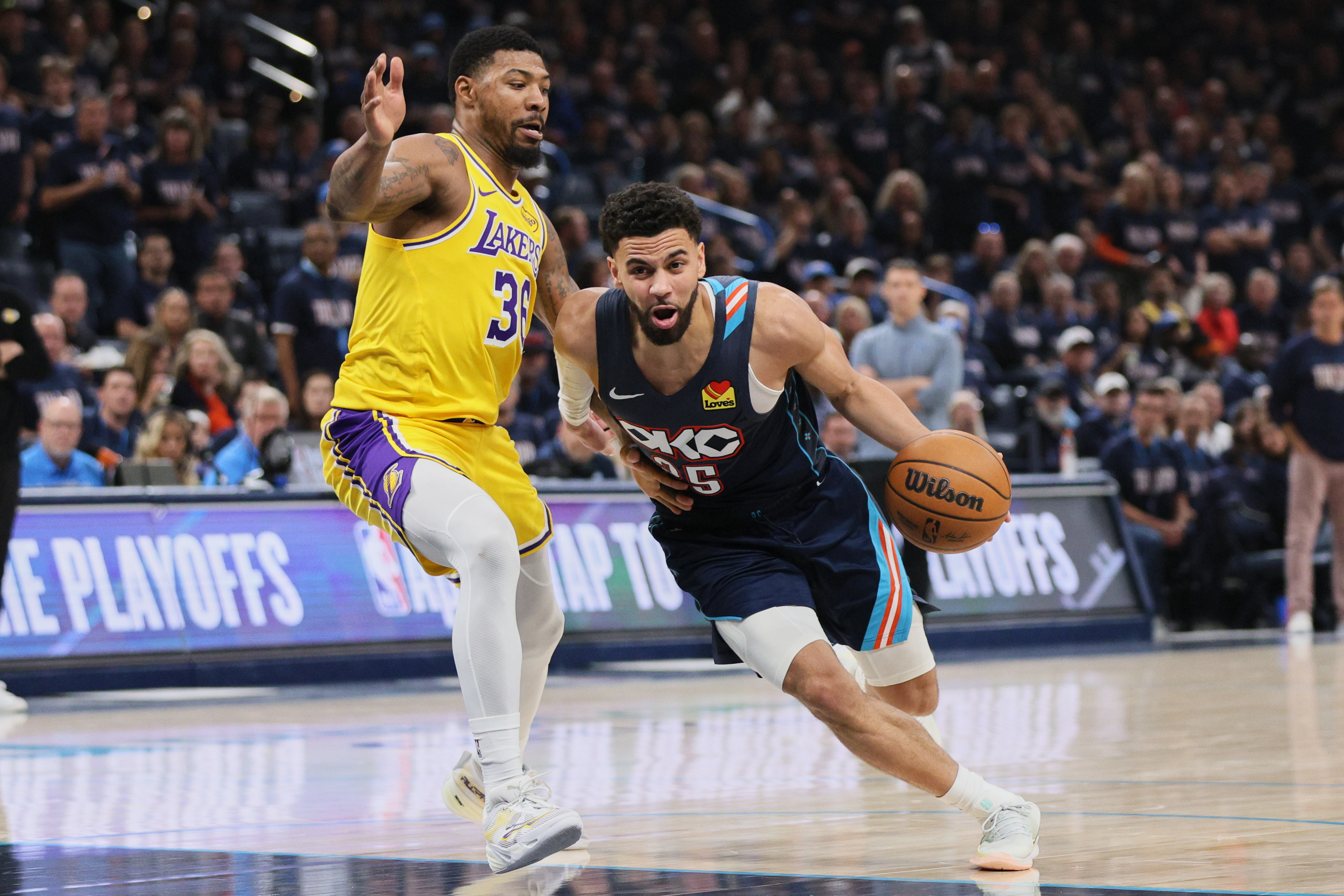 Oklahoma City Thunder guard Ajay Mitchell (25) drives to the basket against Los Angeles Lakers' Marcus Smart (36) in the second half of Game 2 in a second-round NBA basketball playoffs series Thursday, May 7, 2026, in Oklahoma City. 