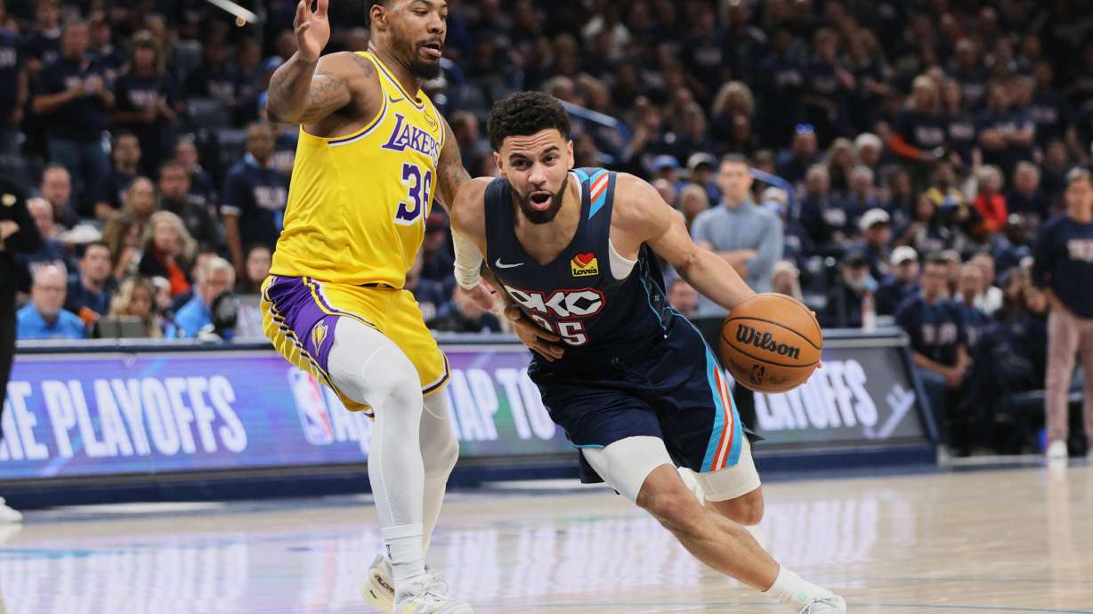 Oklahoma City Thunder guard Ajay Mitchell (25) drives to the basket against Los Angeles Lakers' Marcus Smart (36) in the second half of Game 2 in a second-round NBA basketball playoffs series Thursday, May 7, 2026, in Oklahoma City.