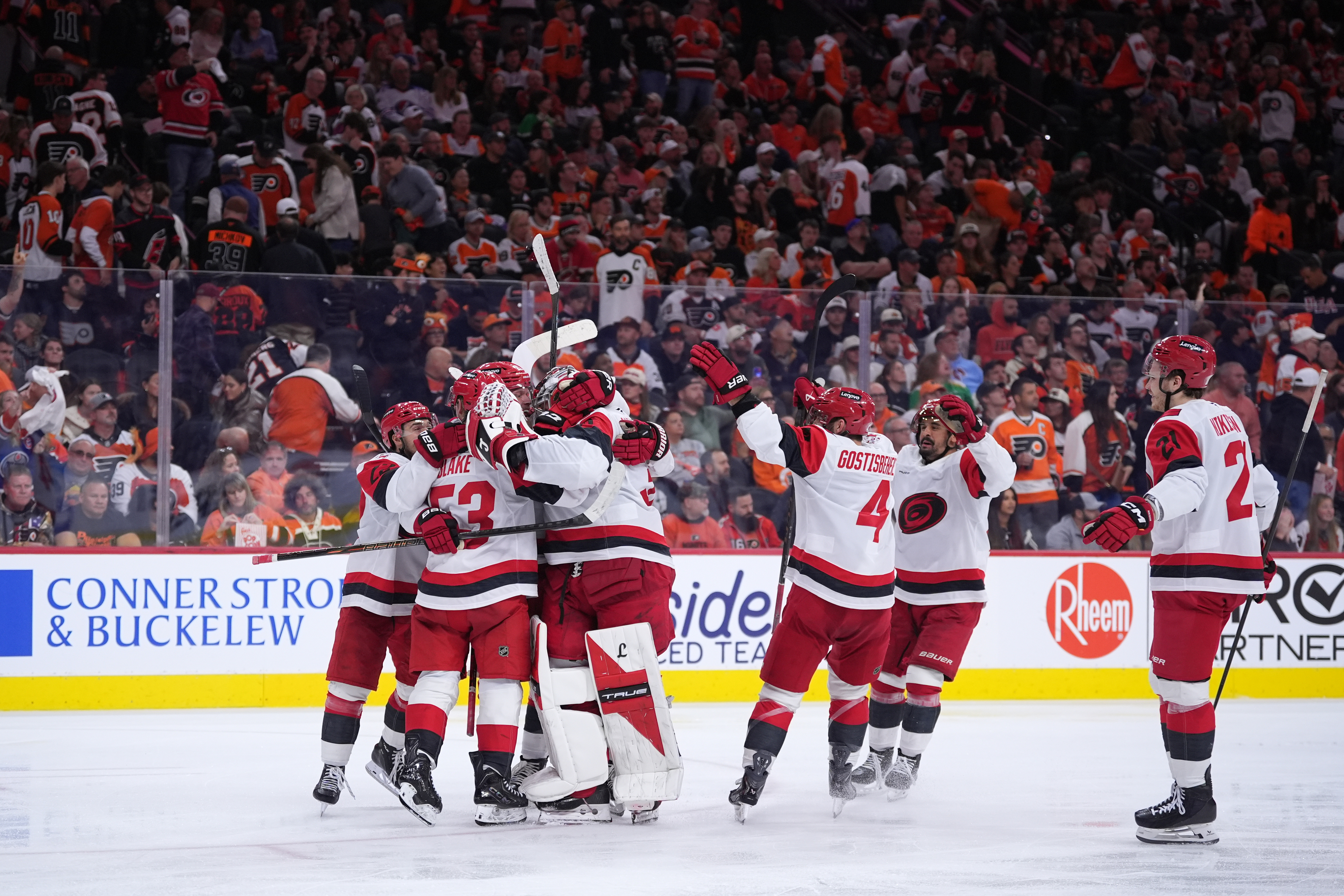 Carolina Hurricanes' players celebrate after winning Game 4 against the Philadelphia Flyers in a second-round NHL hockey Stanley Cup playoff series Saturday, May 9, 2026, in Philadelphia.