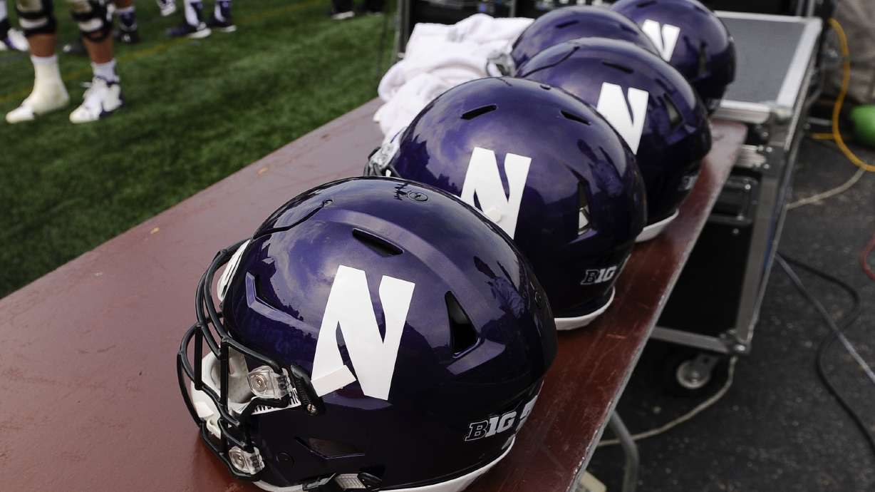 FILE - Northwestern football helmets at an NCAA college football against Stanford in Evanston, Ill, Sept. 5, 2015.