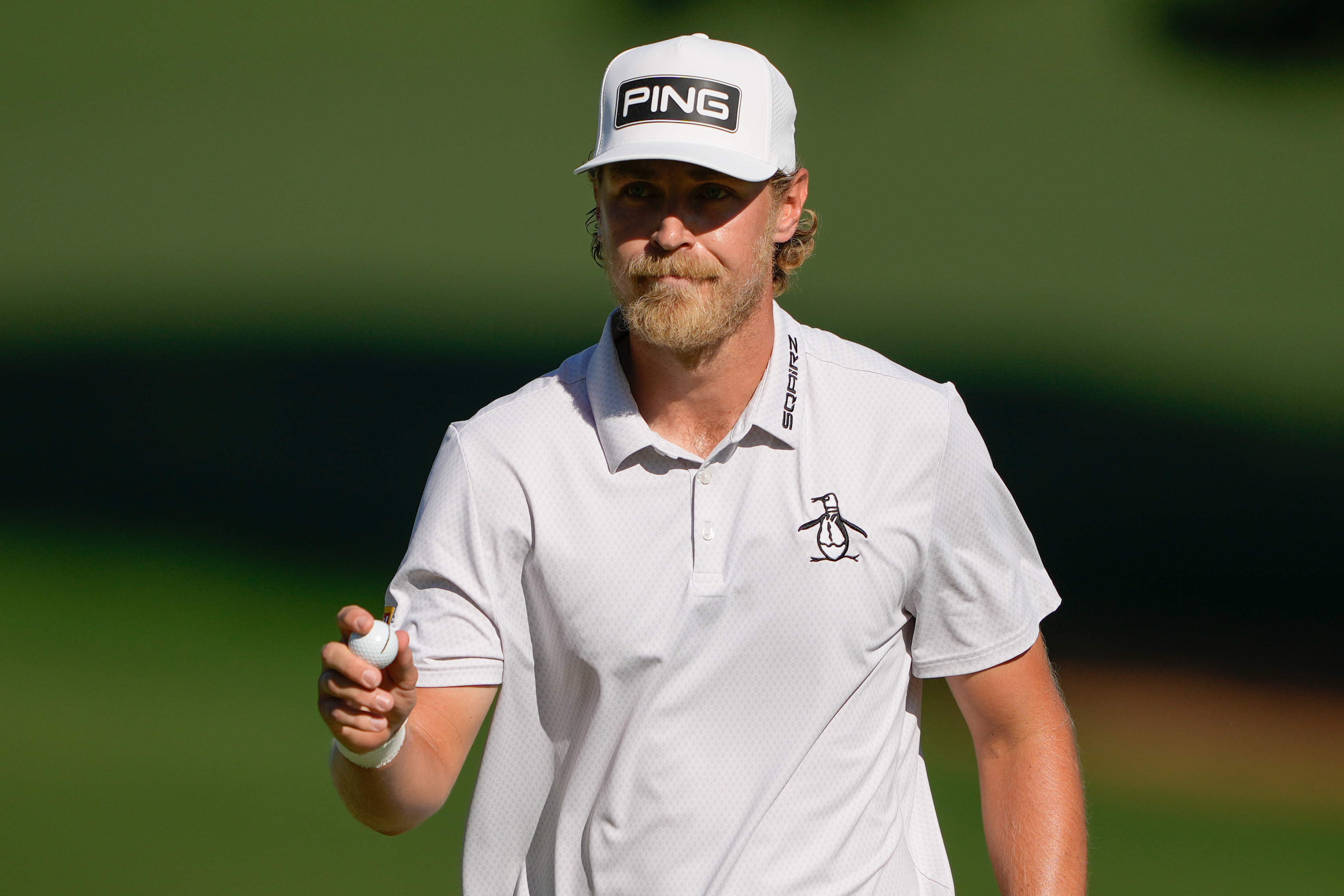 Kristoffer Reitan, of Norway, waves after a birdie on the 15th hole during the final round of the Truist Championship golf tournament at the Quail Hollow Club, Sunday, May 10, 2026, in Charlotte, N.C. 