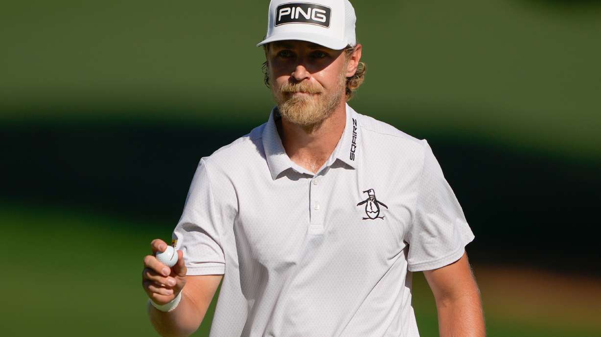 Kristoffer Reitan, of Norway, waves after a birdie on the 15th hole during the final round of the Truist Championship golf tournament at the Quail Hollow Club, Sunday, May 10, 2026, in Charlotte, N.C.