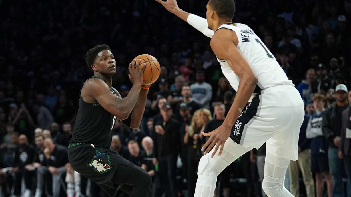 Minnesota Timberwolves guard Anthony Edwards (5) looks to shoot against San Antonio Spurs forward Victor Wembanyama (1) during the first half of Game 4 of a NBA basketball second-round playoff series in Minneapolis, Sunday, May 10, 2026.