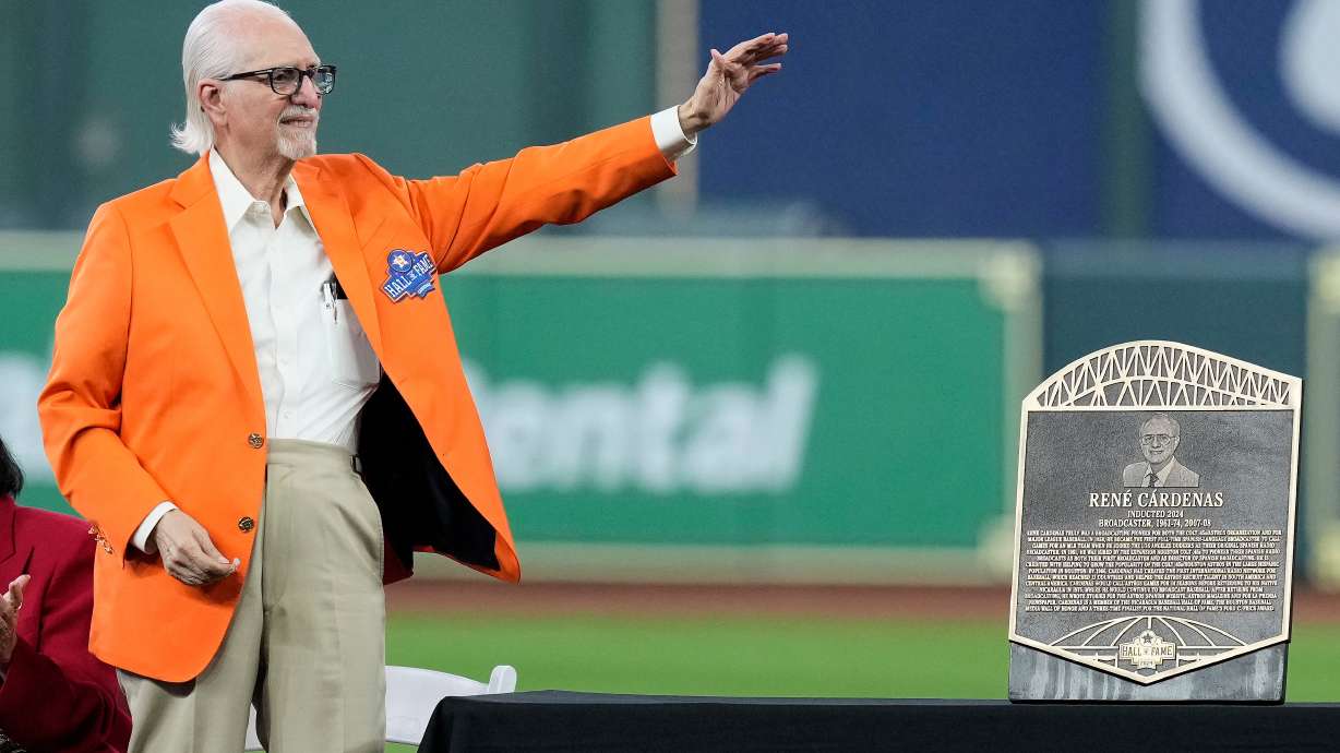FILE - Longtime Spanish radio broadcaster René Cárdenas waves to the crowd as he is inducted into the Houston Astros Hall of Fame Saturday, Aug. 17, 2024, in Houston.