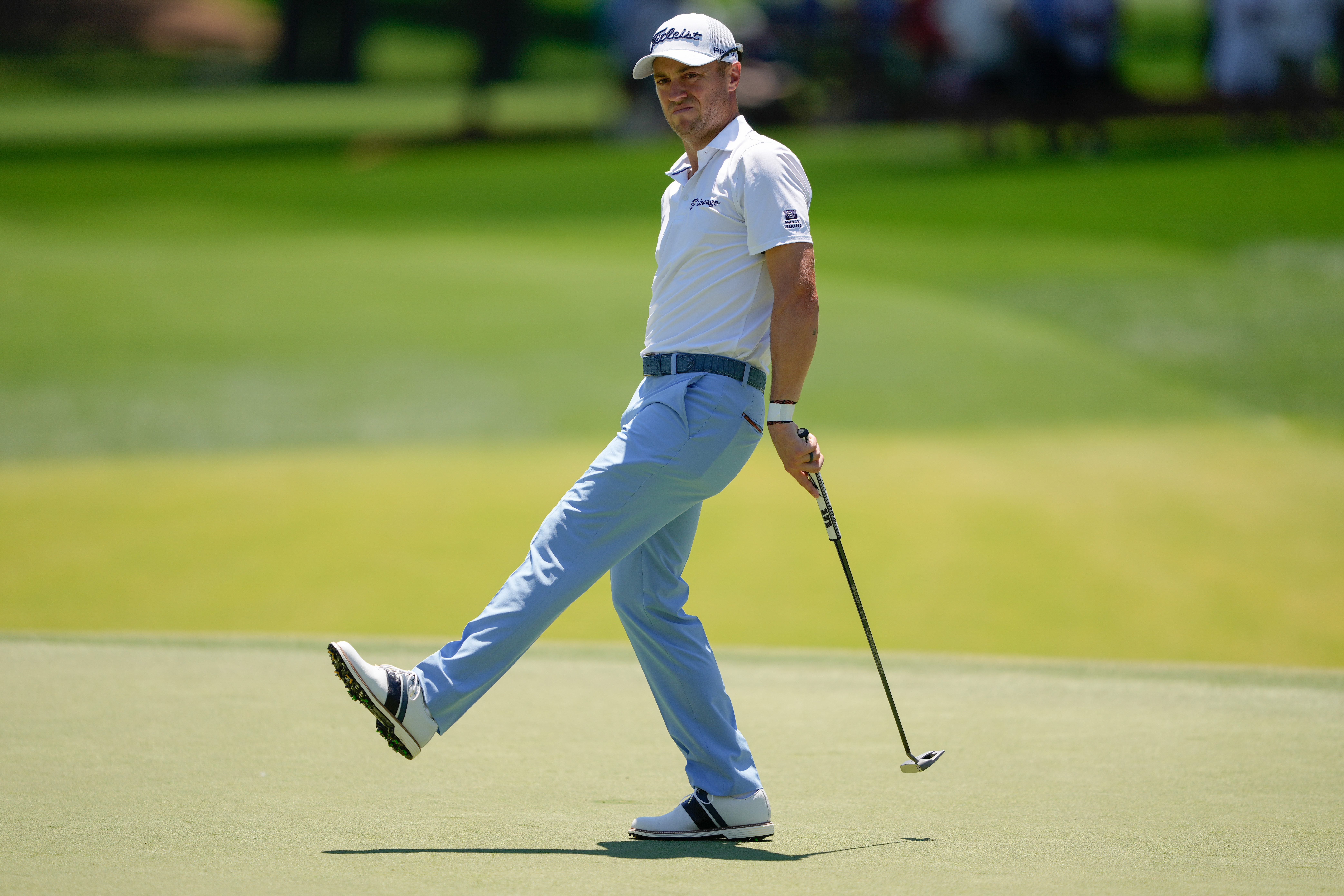 Justin Thomas reacts after missing a putt for birdie on the second hole during the final round of the Truist Championship golf tournament at the Quail Hollow Club, Sunday, May 10, 2026, in Charlotte, N.C. 