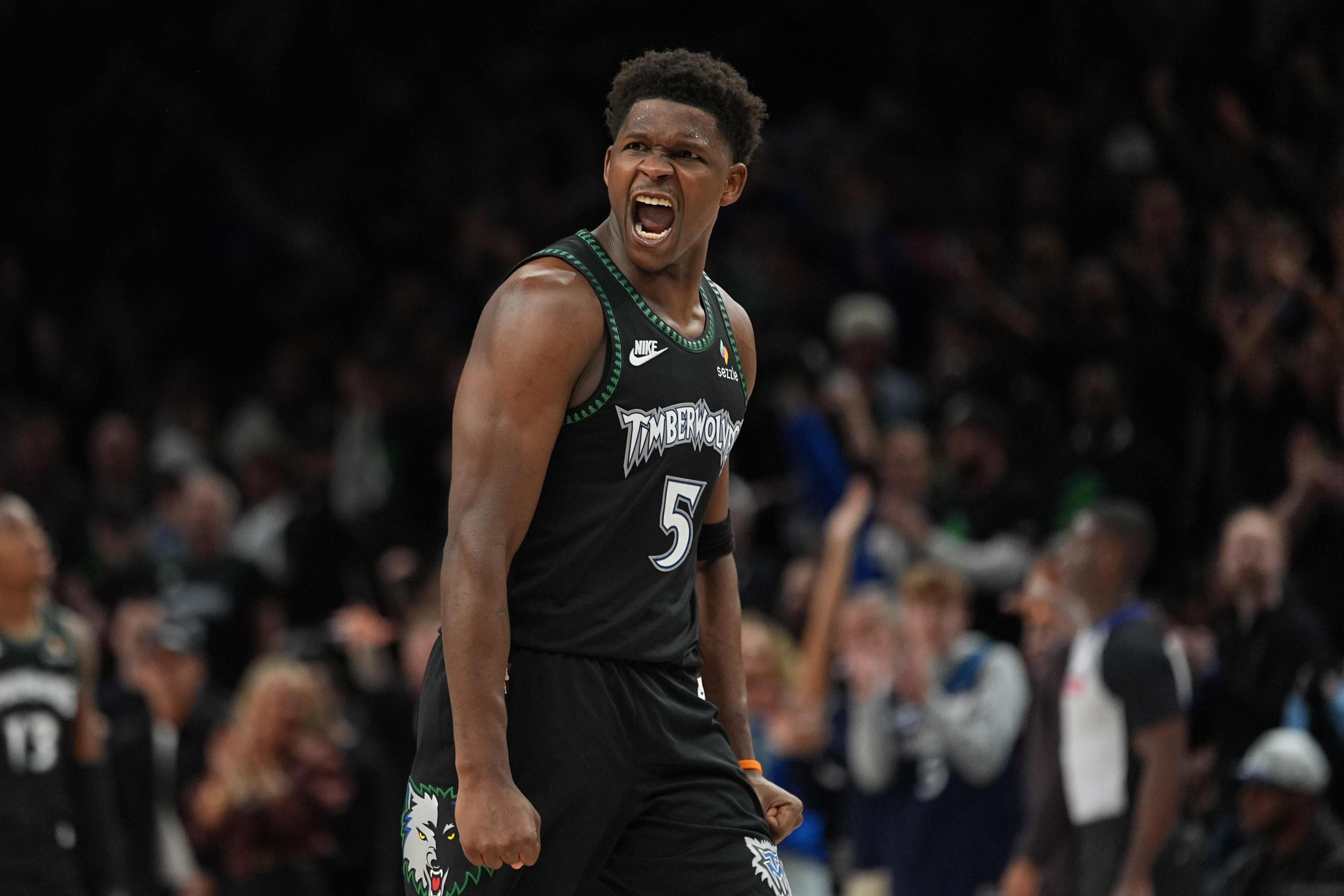 Minnesota Timberwolves guard Anthony Edwards (5) reacts after scoring against the San Antonio Spurs during the second half of Game 4 of an NBA basketball second-round playoffs series in Minneapolis, Sunday, May 10, 2026. 