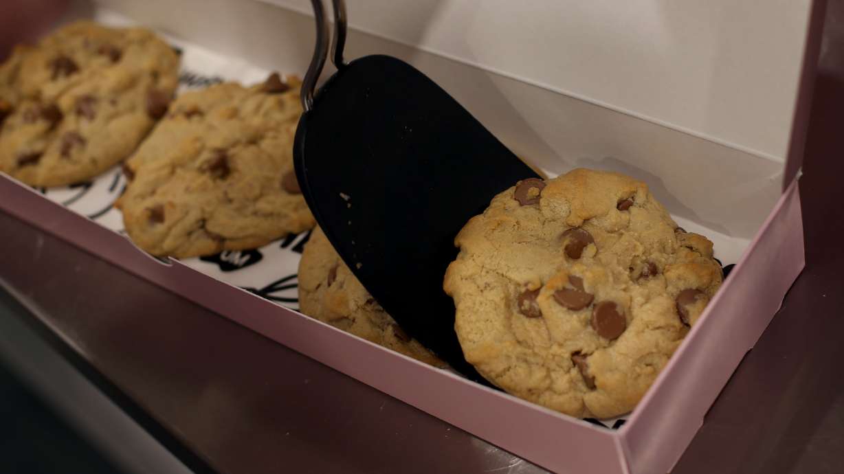 An order of cookies is prepared for a customer at Crumbl in Lehi on Dec. 21, 2018. The Utah-based company's cofounders announced Monday that they are stepping down from "day-to-day operating roles" after nearly a decade.