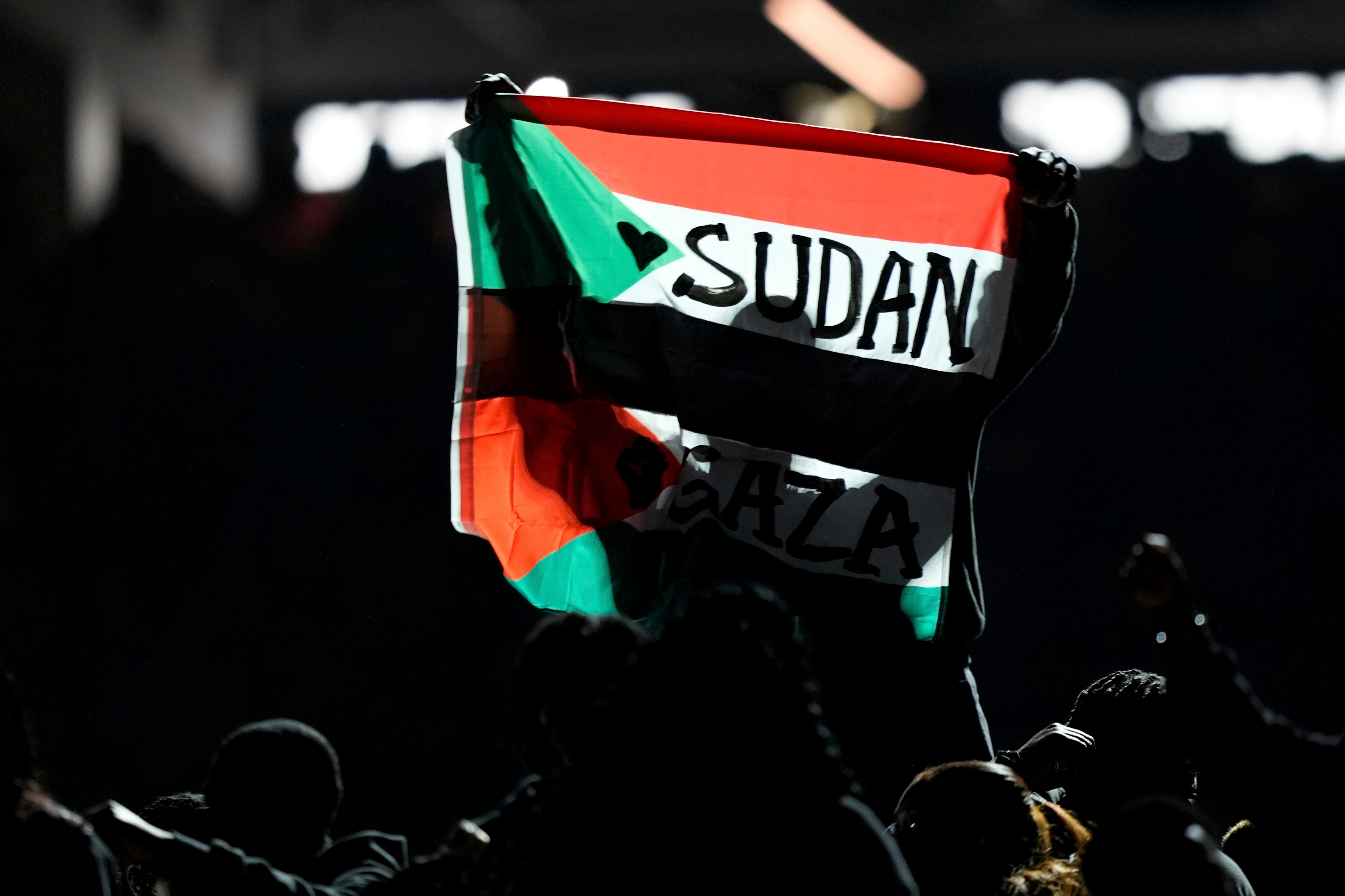 FILE - A flag is raised during halftime of the NFL Super Bowl 59 football game between the Kansas City Chiefs and the Philadelphia Eagles, Feb. 9, 2025, in New Orleans.
