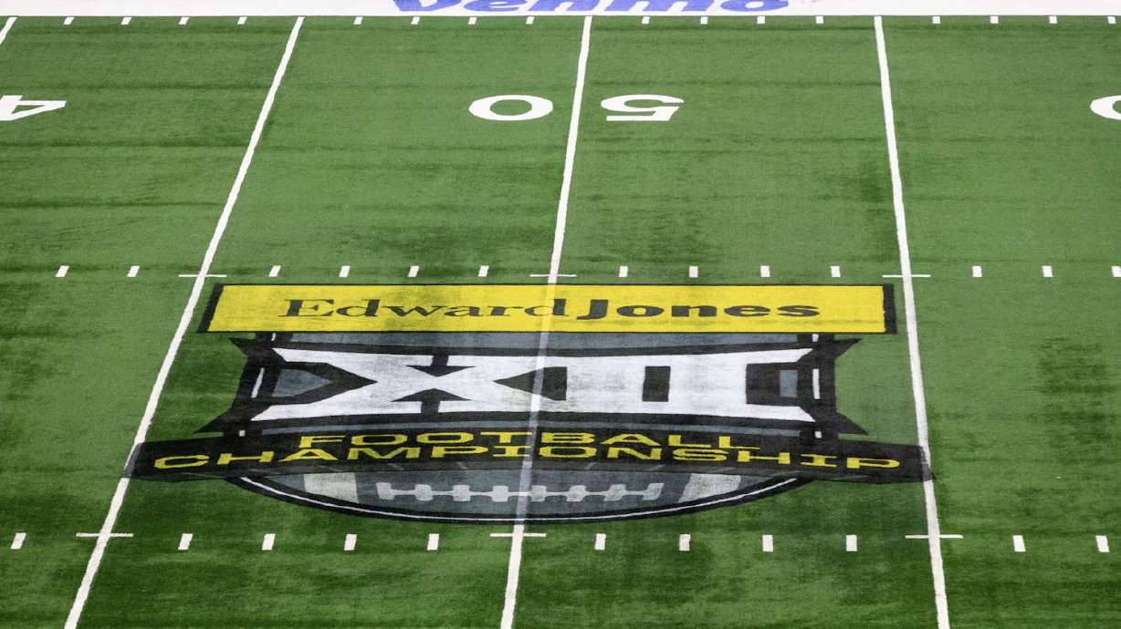 The Big 12 logo is displayed on the field at AT&T Stadium in Arlington, Texas, on Dec. 6, 2025. A new deal with RedBird Capital Partners and Weatherford Capital offers each Big 12 school up to a $30 million line of credit.