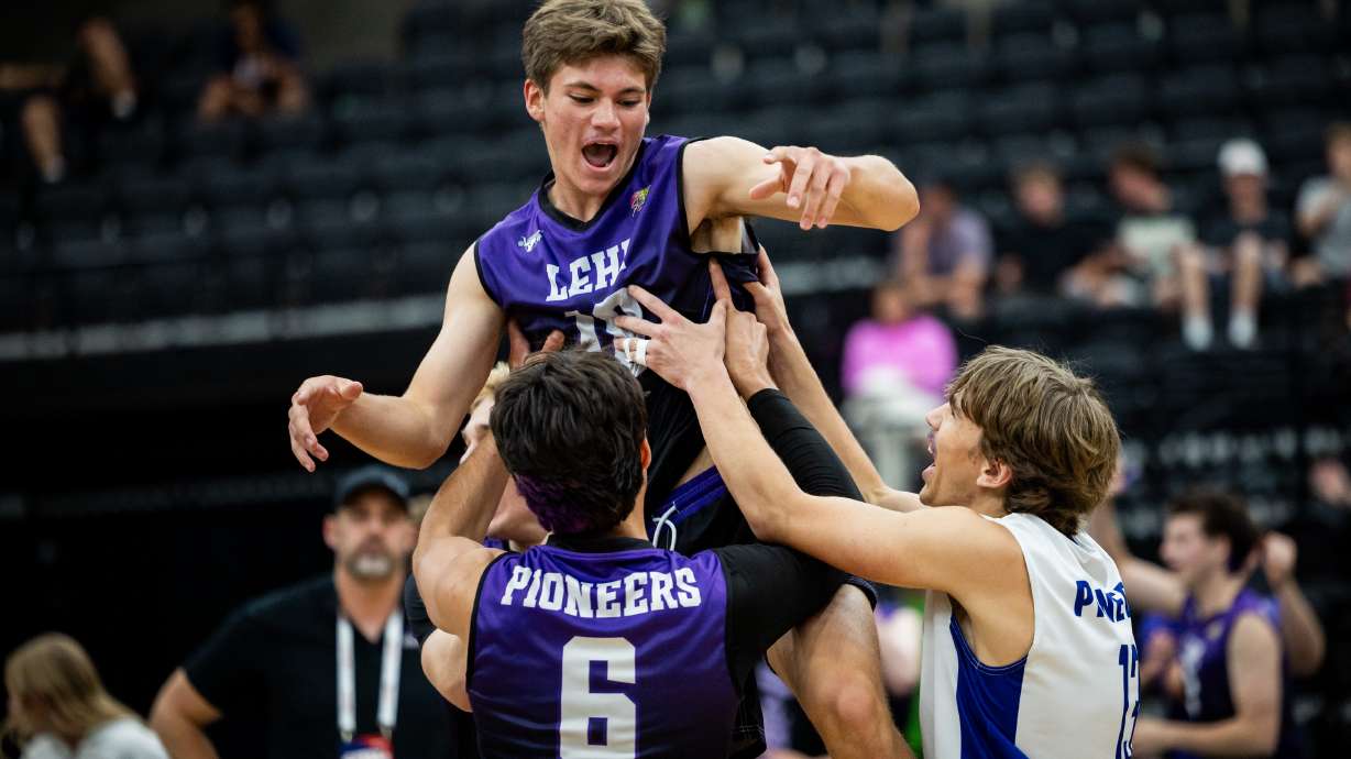 The Lehi Pioneers lift setter Ty Reynolds (18) in the air during the 6A boys volleyball state championship against the Bingham Miners held at the UCCU Center in Orem on Thursday, May 7, 2026.