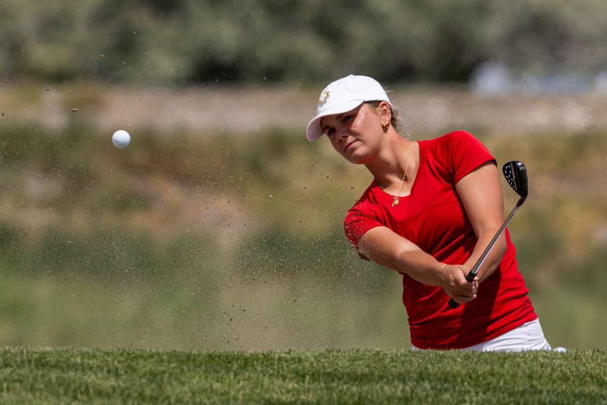 Crimson Cliffs’ Kate Walker hits a bunker shot during the final round of the 4A girls golf state championship at Glendale Golf Course in Salt Lake City on Thursday, May 7, 2026.