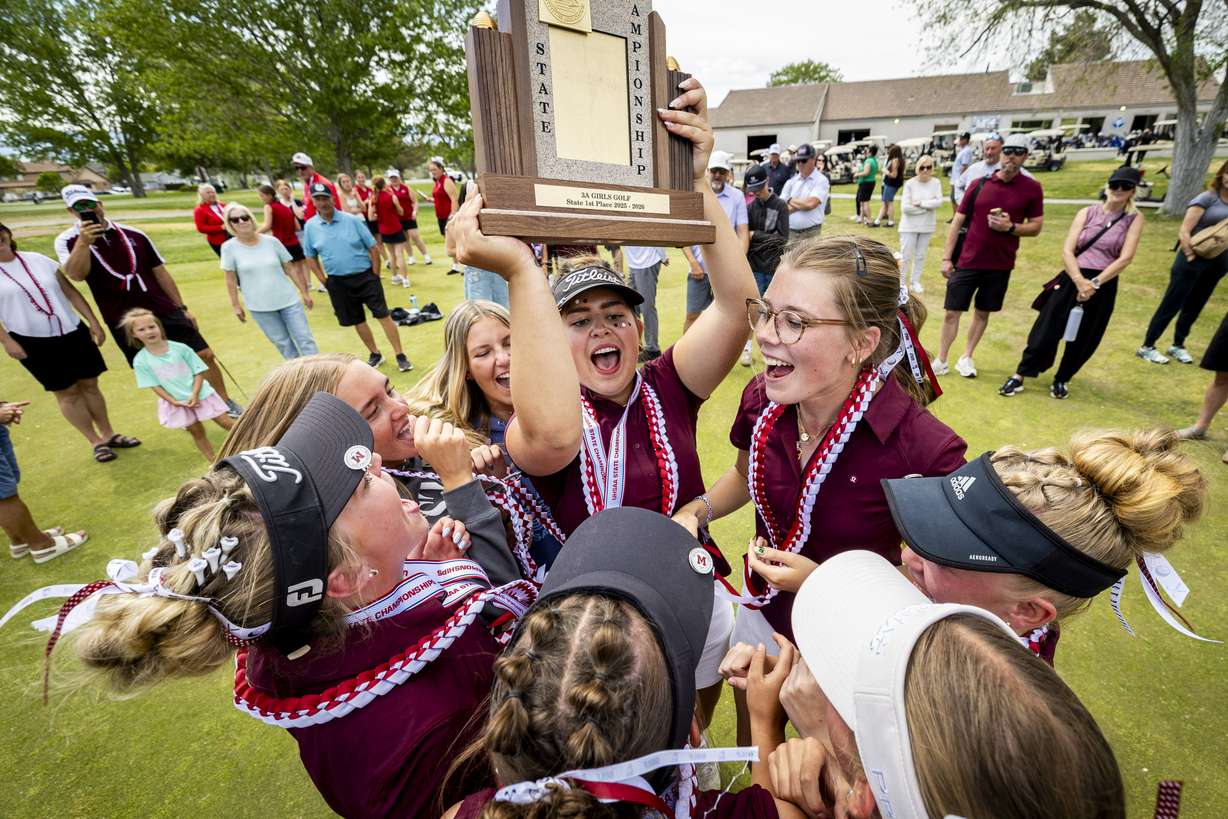 Morgan’s Kenadee Benson cheers with her teammates as she holds the team championship trophy after the final round of the 3A girls golf state championship held at the Stansbury Park Golf Course on Thursday, May 7, 2026. Benson won the individual championship in addition to Morgan’s first-place team victory.