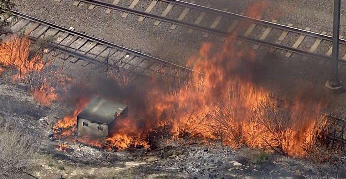 A fast-moving brush fire fueled by dry grass and challenging access conditions broke out along the TRAX line in Murray Monday afternoon. The fire started just before 1 p.m. near 5300 South and Cottonwood Street.