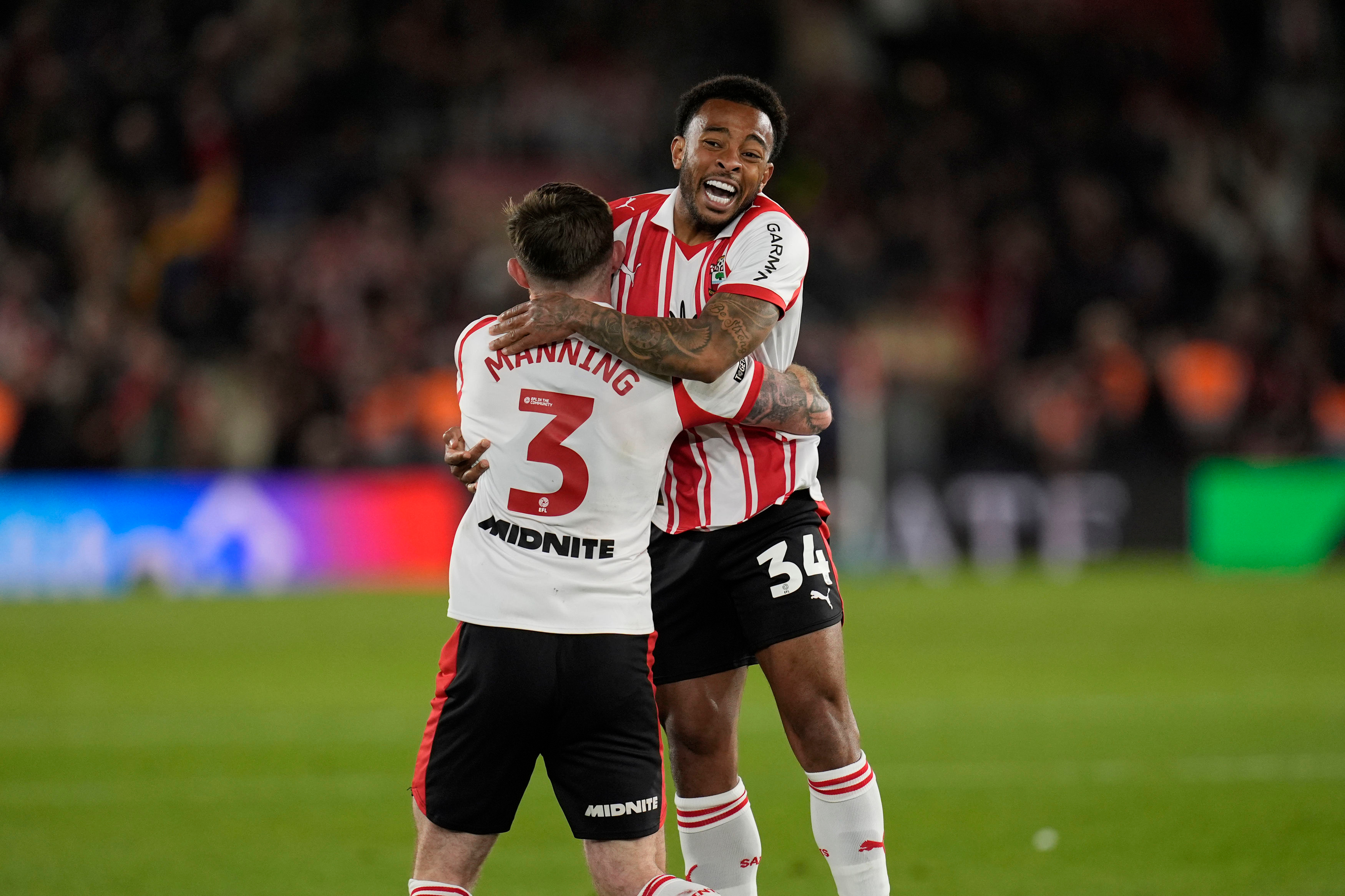 Southampton's Welington, right, and Ryan Manning celebrate at the final whistle in the EFL Championship play off semifinal soccer game between Southampton and Middlesbrough, Tuesday, May 12, 2026, in, Southampton, England.
