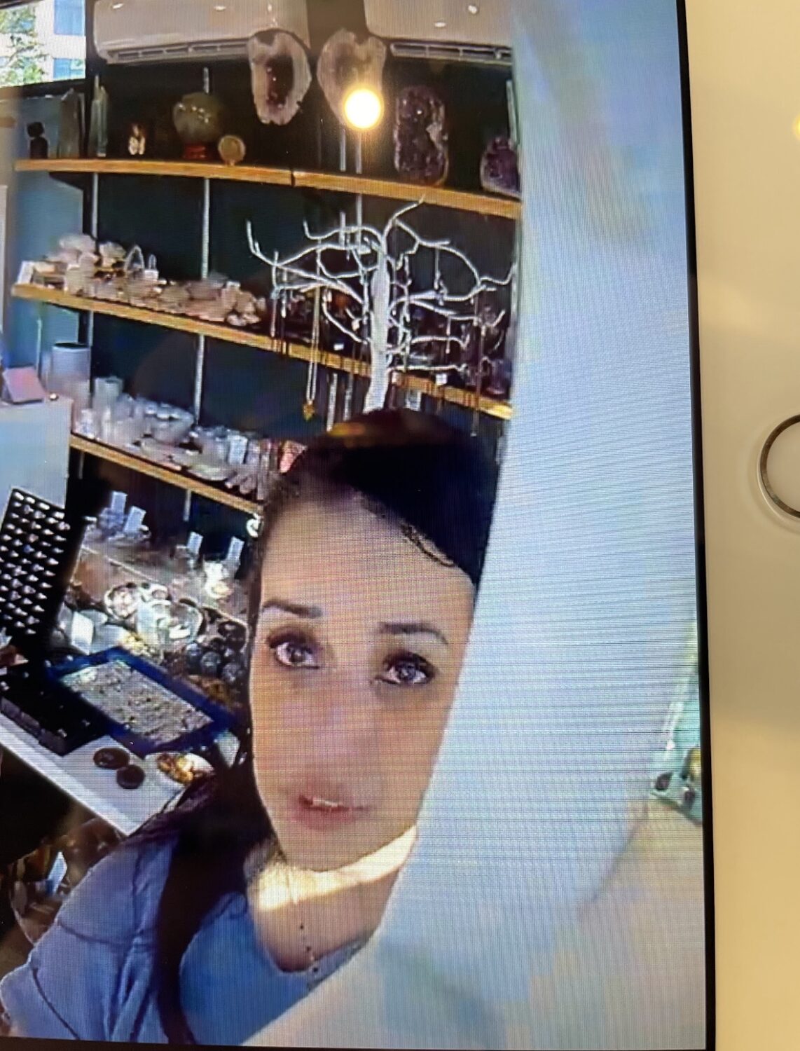 A woman is seen in surveillance video at Rising Moon Minerals in Riverton on Friday. She is believed to have stolen hundreds of dollars' worth of merchandise after spending nearly 45 minutes at the store.
