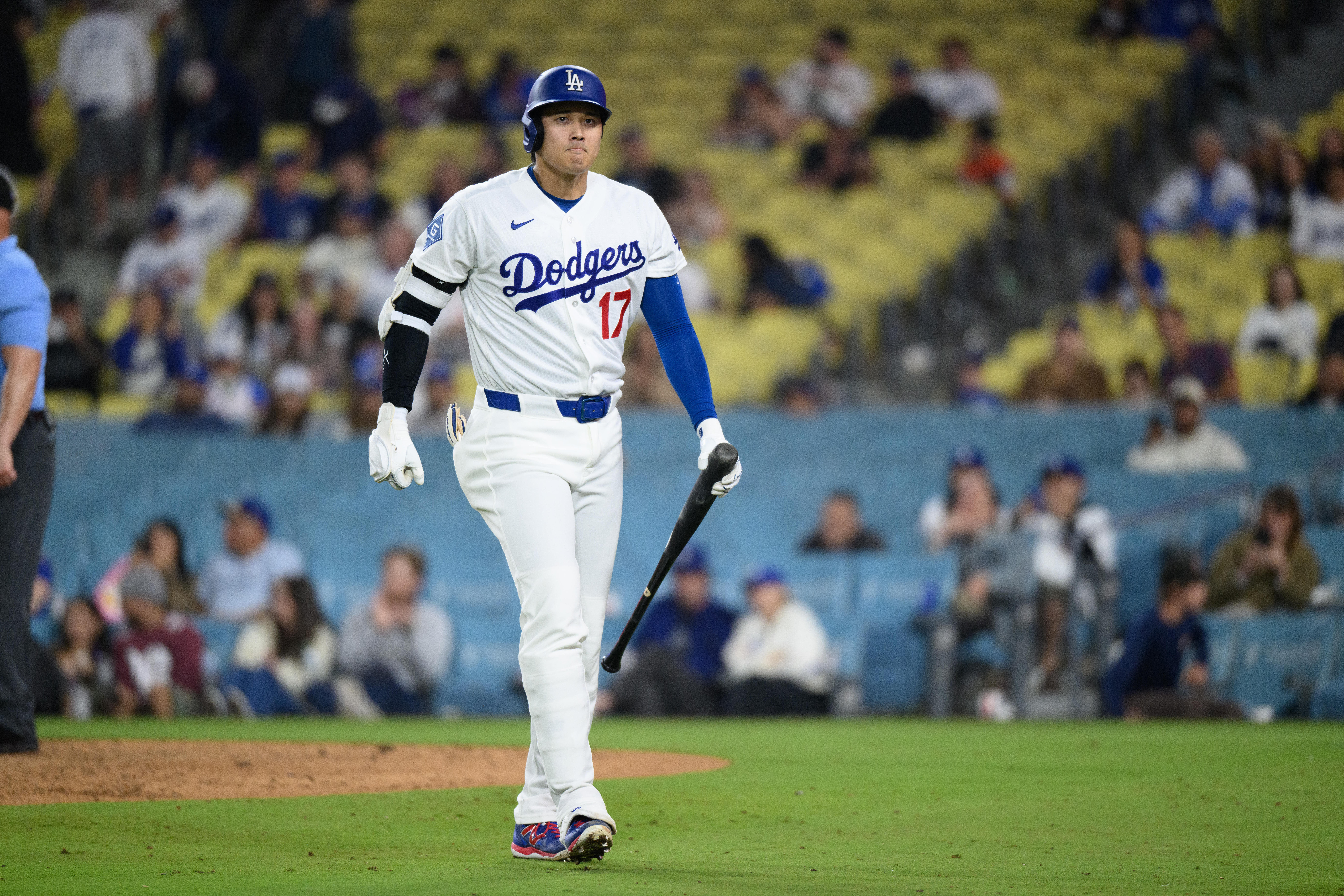 Los Angeles Dodgers' Shohei Ohtani walks back to the dugout after striking out during the ninth inning of a baseball game against the San Francisco Giants in Los Angeles, Monday, May 11, 2026. 