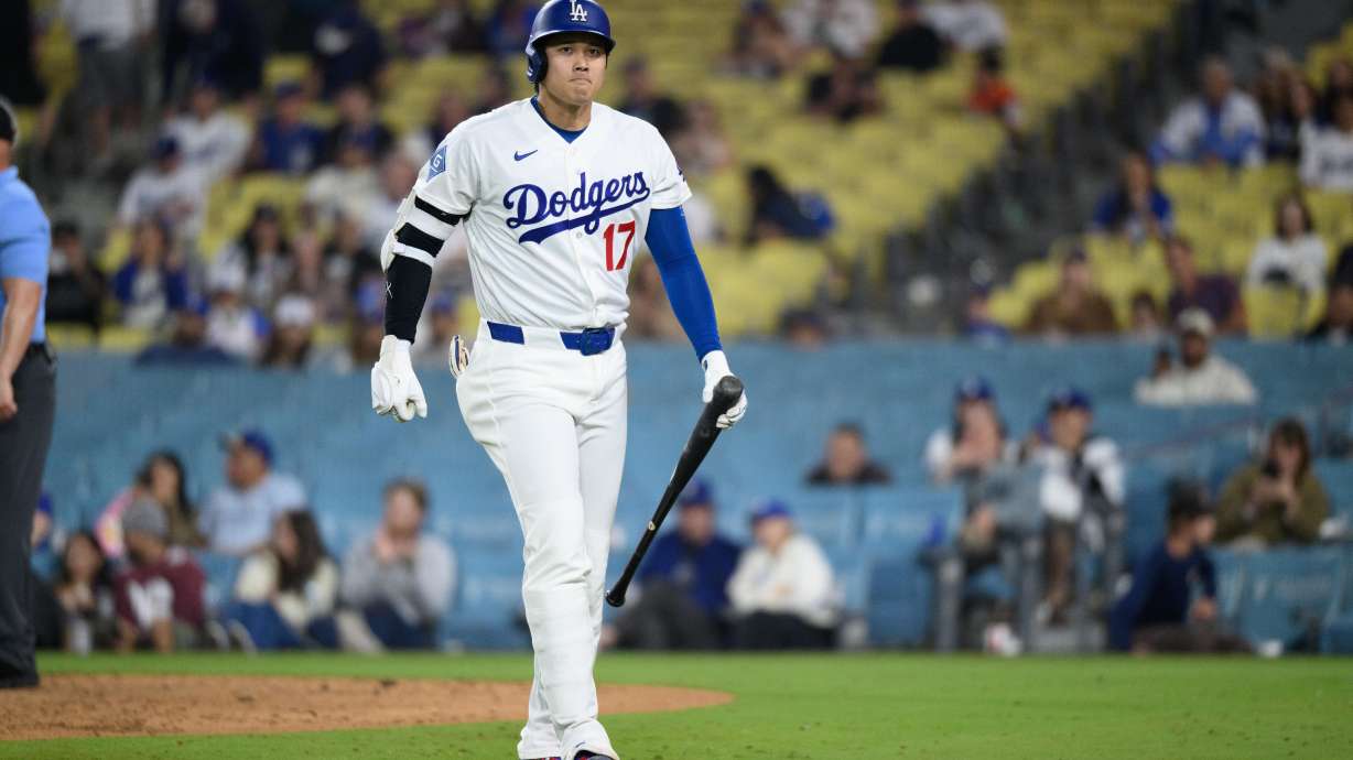 Los Angeles Dodgers' Shohei Ohtani walks back to the dugout after striking out during the ninth inning of a baseball game against the San Francisco Giants in Los Angeles, Monday, May 11, 2026.