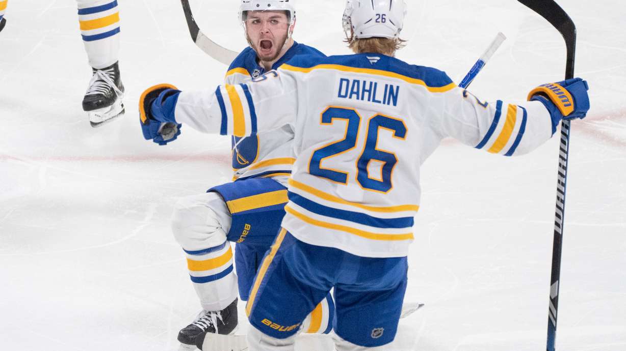 Buffalo Sabres' Zach Benson (6) celebrates his goal over Montreal Canadiens with teammate Rasmus Dahlin (26) during third period, second round, game 4, NHL playoff action in Montreal on Tuesday, May 12, 2026.
