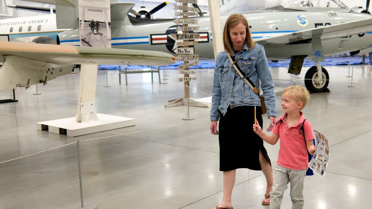 Blue Star family members Dani Meyers and Gavin Meyers, 4, do a scavenger hunt during an event to announce the Blue Star Museum program at the Hill Aerospace Museum at Hill Air Force Base on Tuesday. The program runs May 16-Sept. 7.