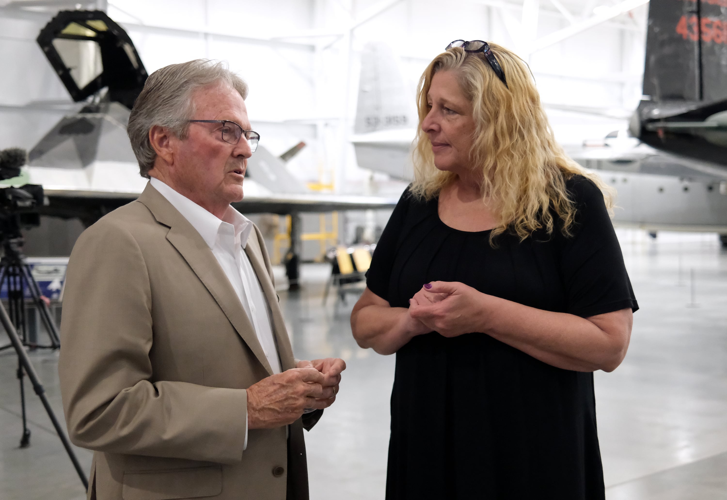 Sen. Jerry Stevenson, R-Layton, talks with Mary Anne Carter, National Endowment for the Arts chairman, at an event to announce the Blue Star Museum program, which offers free museum access to active military personnel and their families, at the Hill Aerospace Museum at Hill Air Force Base on Tuesday. The program runs May 16-Sept. 7.
