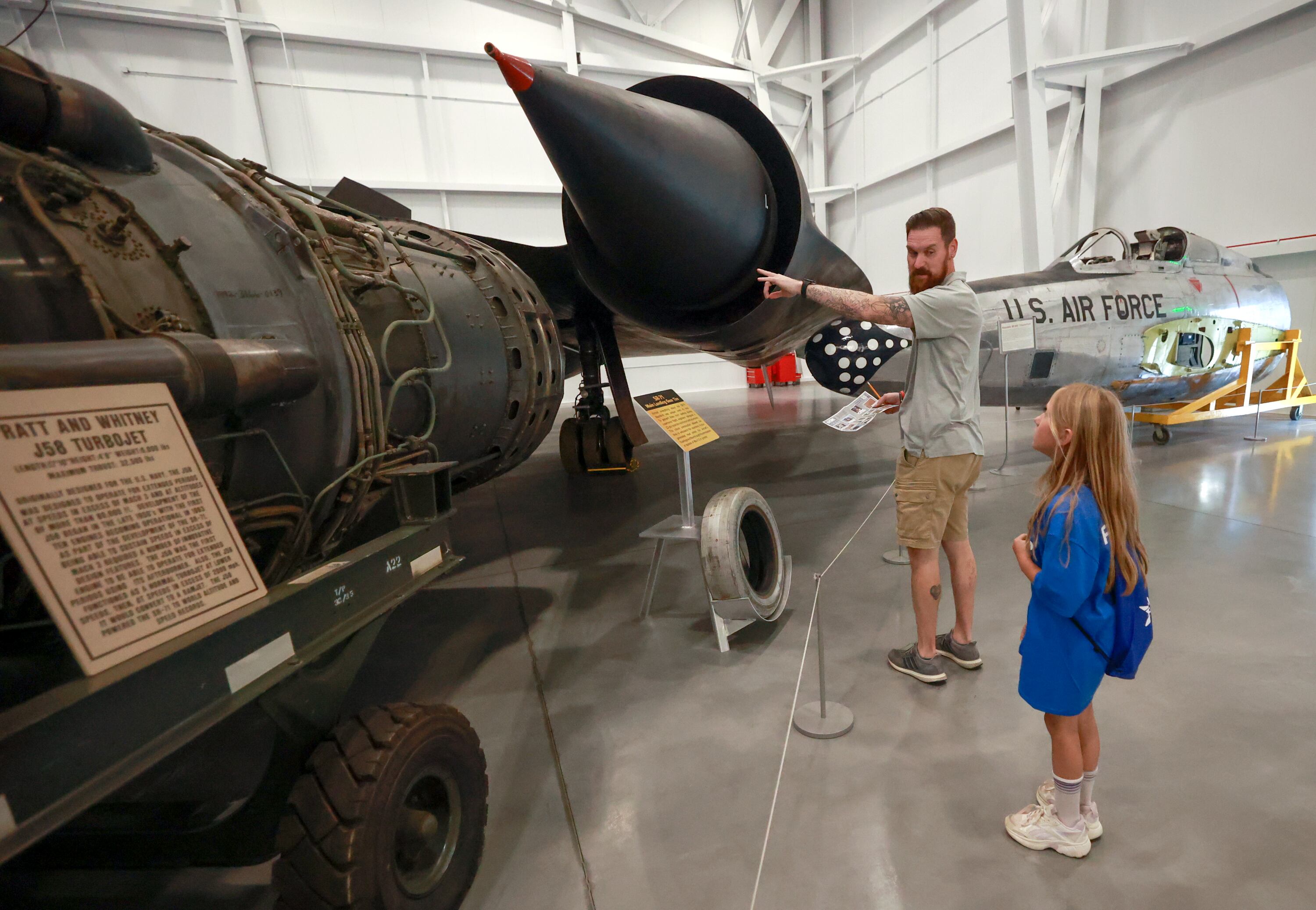 Rich Vengels, a retired Air Force veteran, and Brielle Vengels do a scavenger hunt at an event to announce the Blue Star Museum program, which offers free museum access to active military personnel and their families, at the Hill Aerospace Museum at Hill Air Force Base on Tuesday. The program runs May 16-Sept. 7.