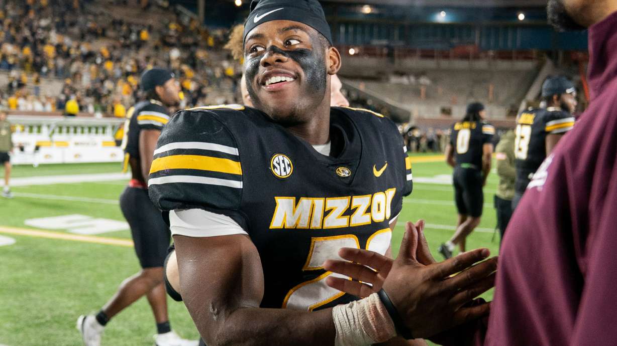 Missouri running back Ahmad Hardy, left, is congratulated after his team defeated Mississippi State in an NCAA college football game Nov. 15, 2025, in Columbia, Mo.