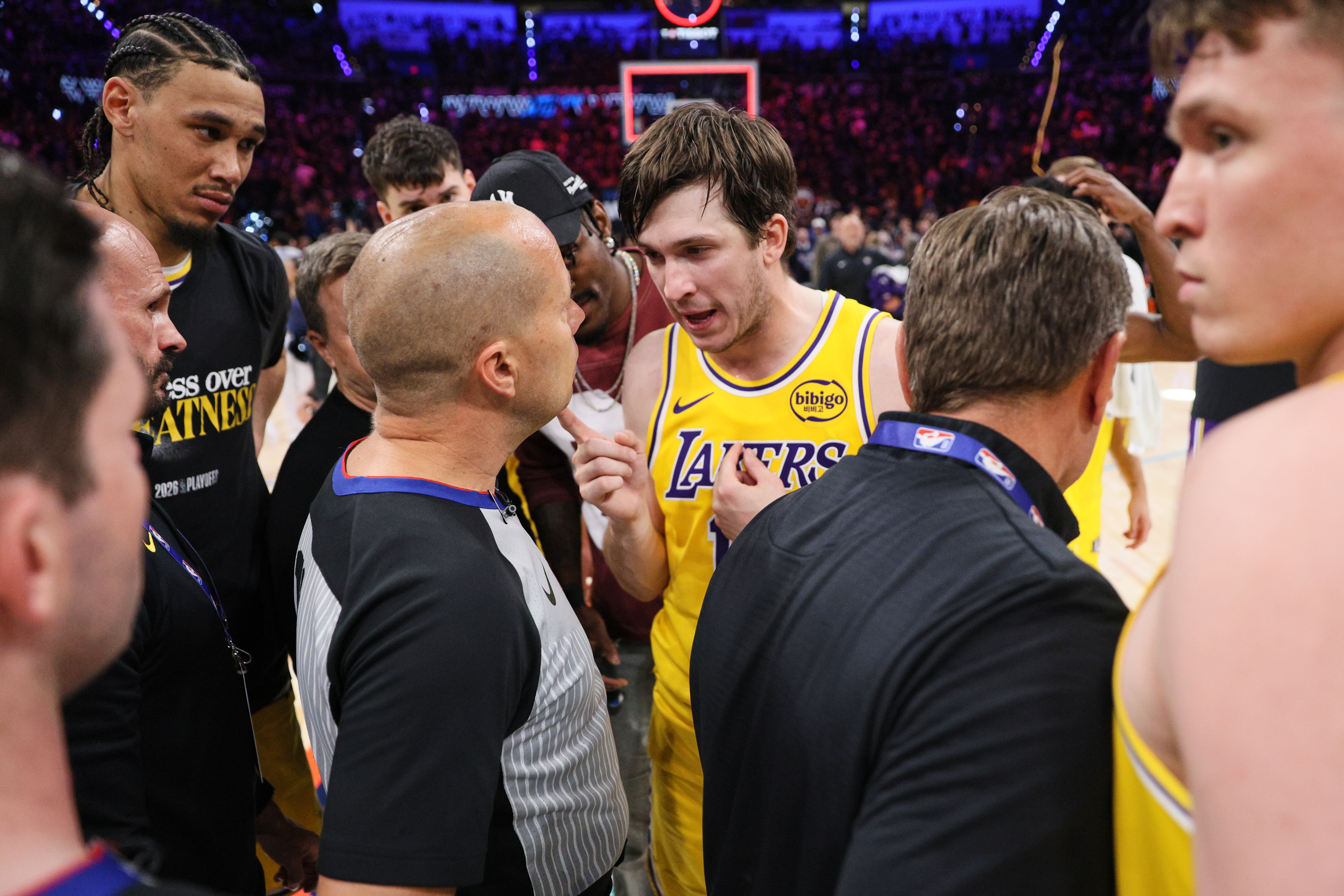 Los Angeles Lakers' Austin Reaves, center right, talks with referee John Goble, center, left, after the team's loss in Game 2 in a second-round NBA basketball playoffs series against the Oklahoma City Thunder Thursday, May 7, 2026, in Oklahoma City.
