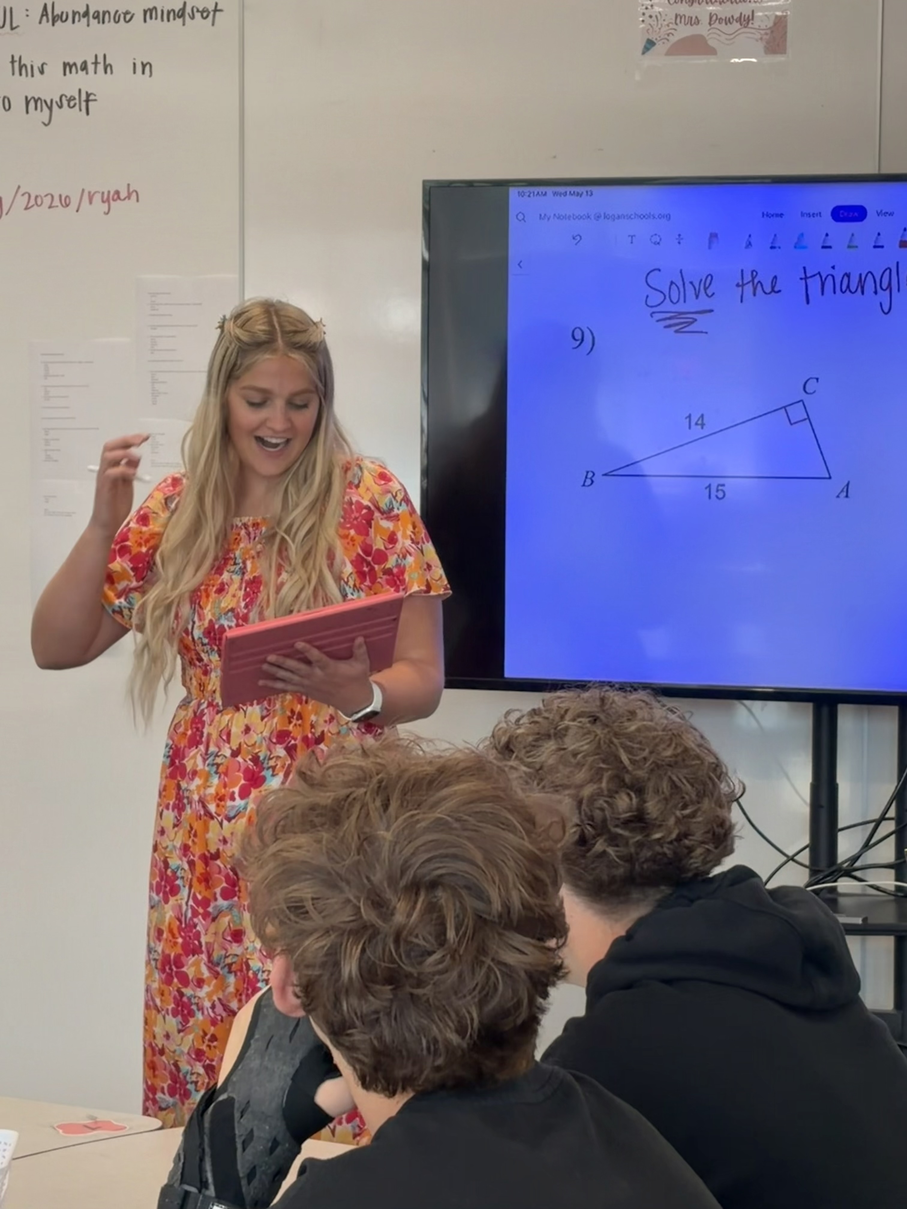 Logan High School math teacher Ryah Dowdy helps students during a class on Wednesday. Dowdy, a semifinalist in the America's Favorite Teacher competition, hopes to give back to the community if she wins.
