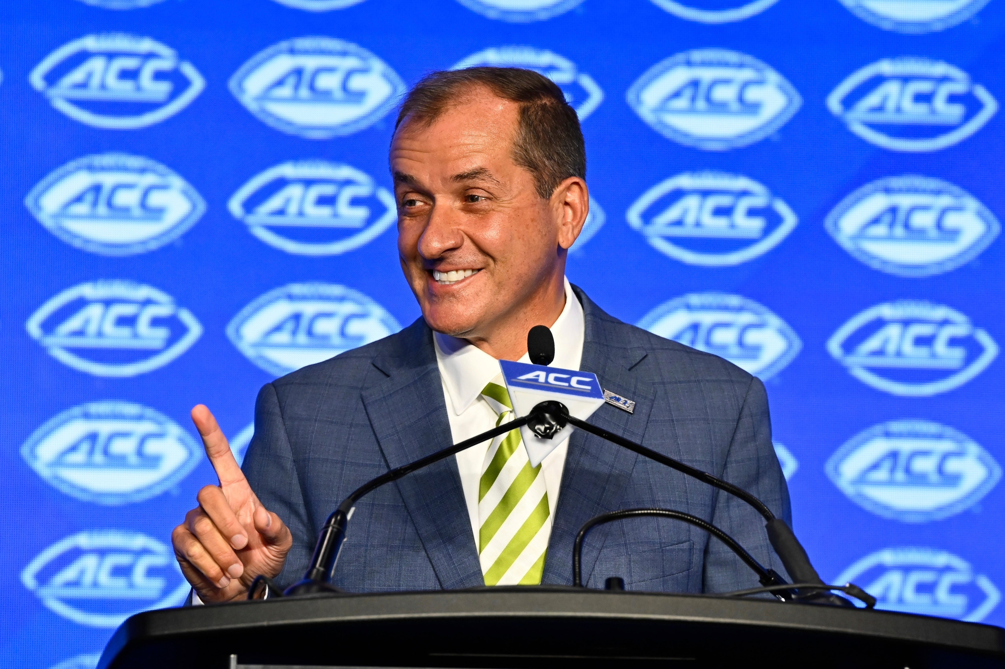 FILE - Atlantic Coast Conference commissioner Jim Phillips smiles during an NCAA college football news conference at the ACC media days, July 22, 2024, in Charlotte, N.C. 
